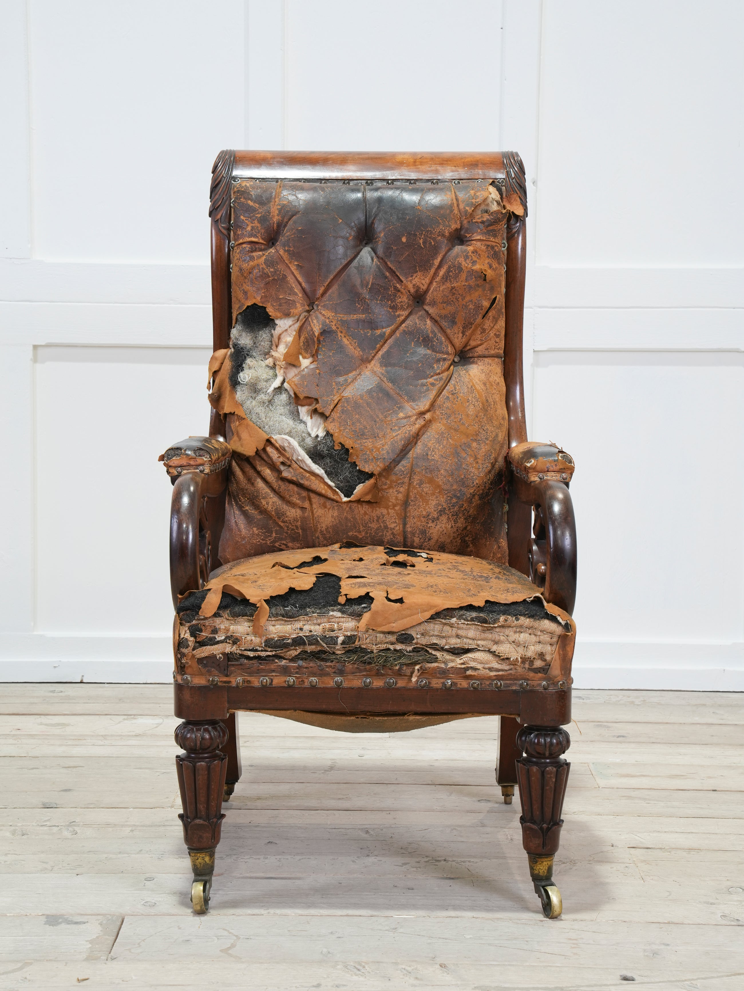 A 19th Century Neo- Classical Mahogany Library Chair