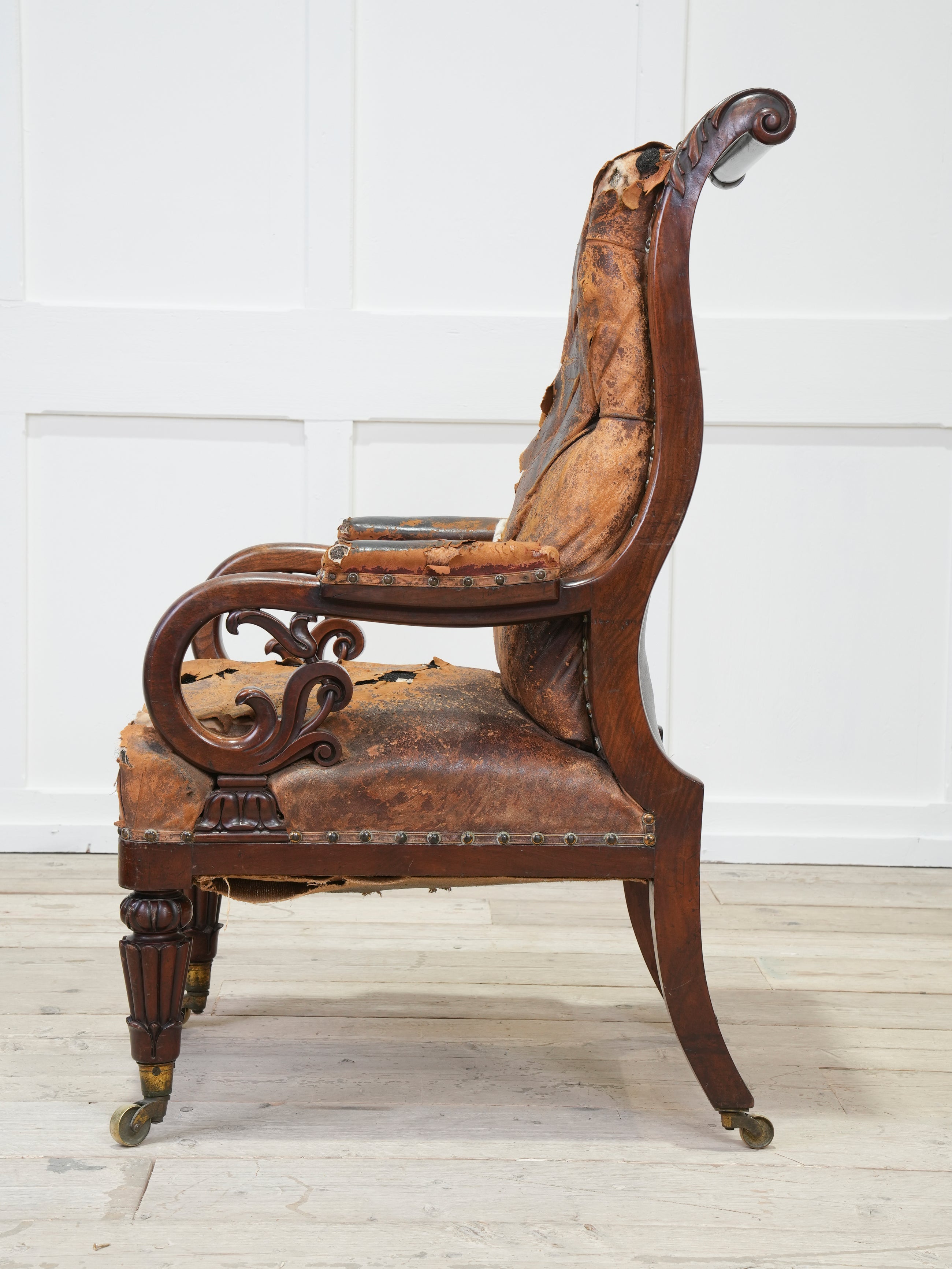 A 19th Century Neo- Classical Mahogany Library Chair