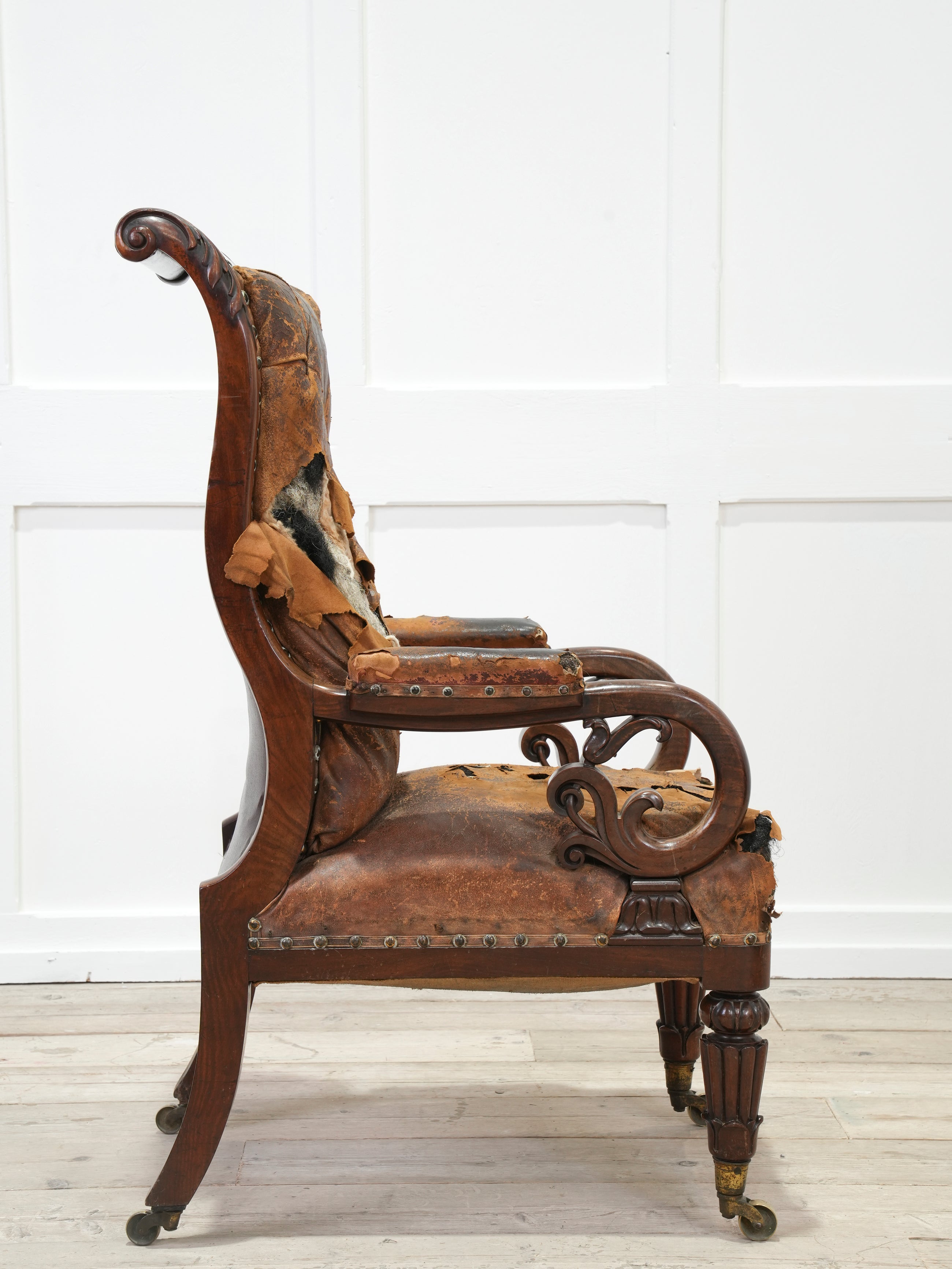 A 19th Century Neo- Classical Mahogany Library Chair
