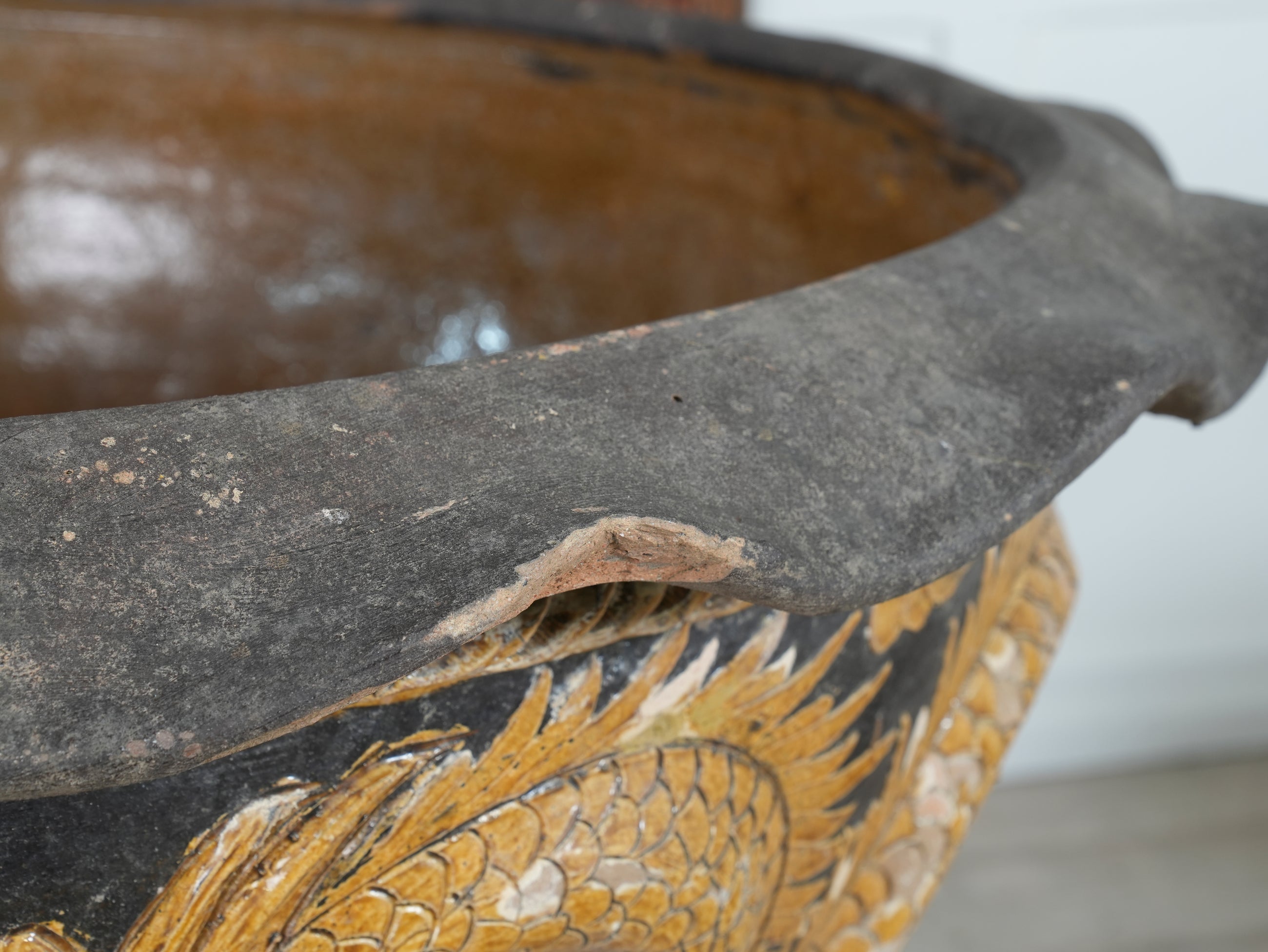 A Large Glazed Terracotta Dragon Bowl