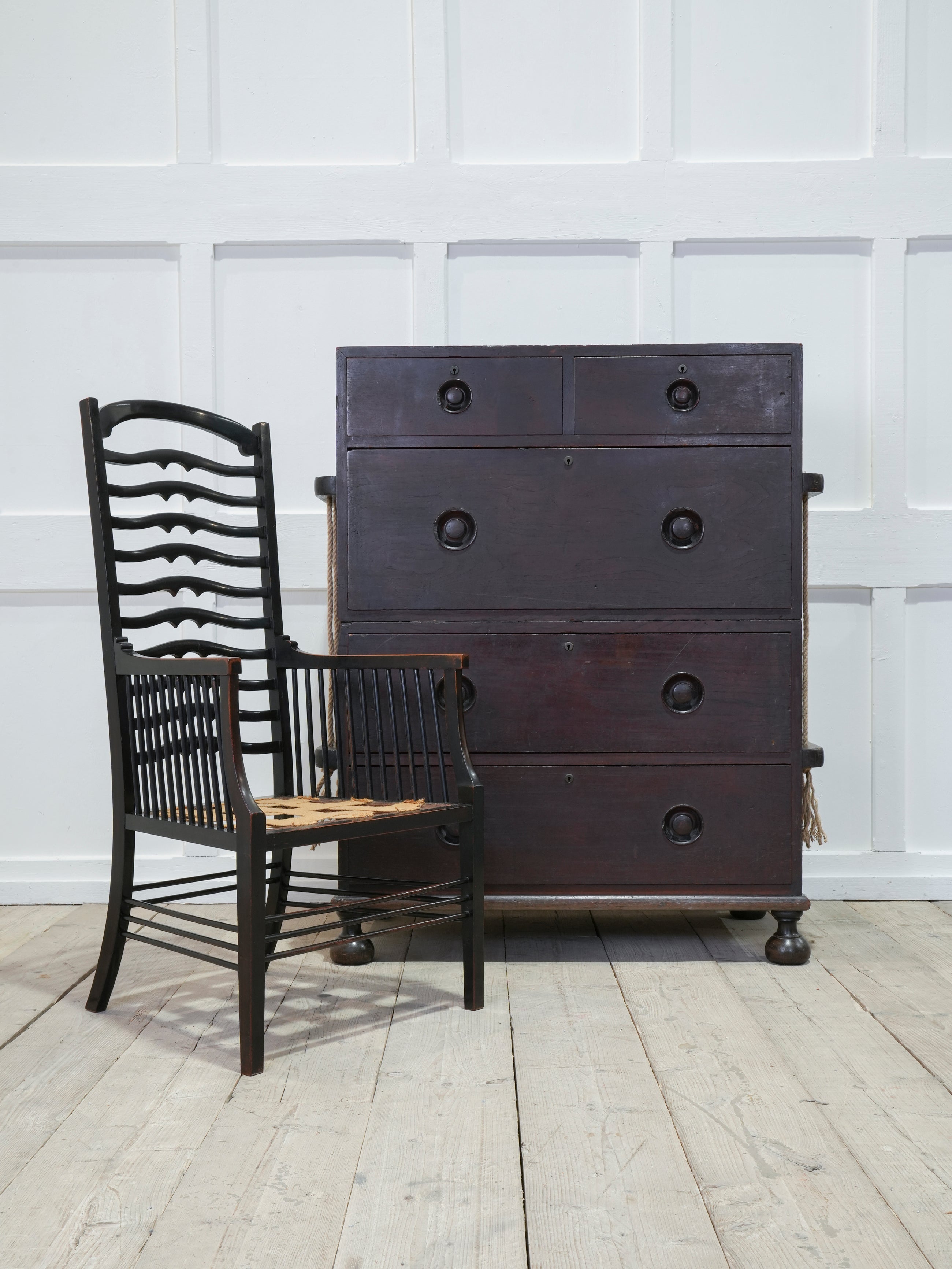 An Ebonised Ladder Back Arm Chair