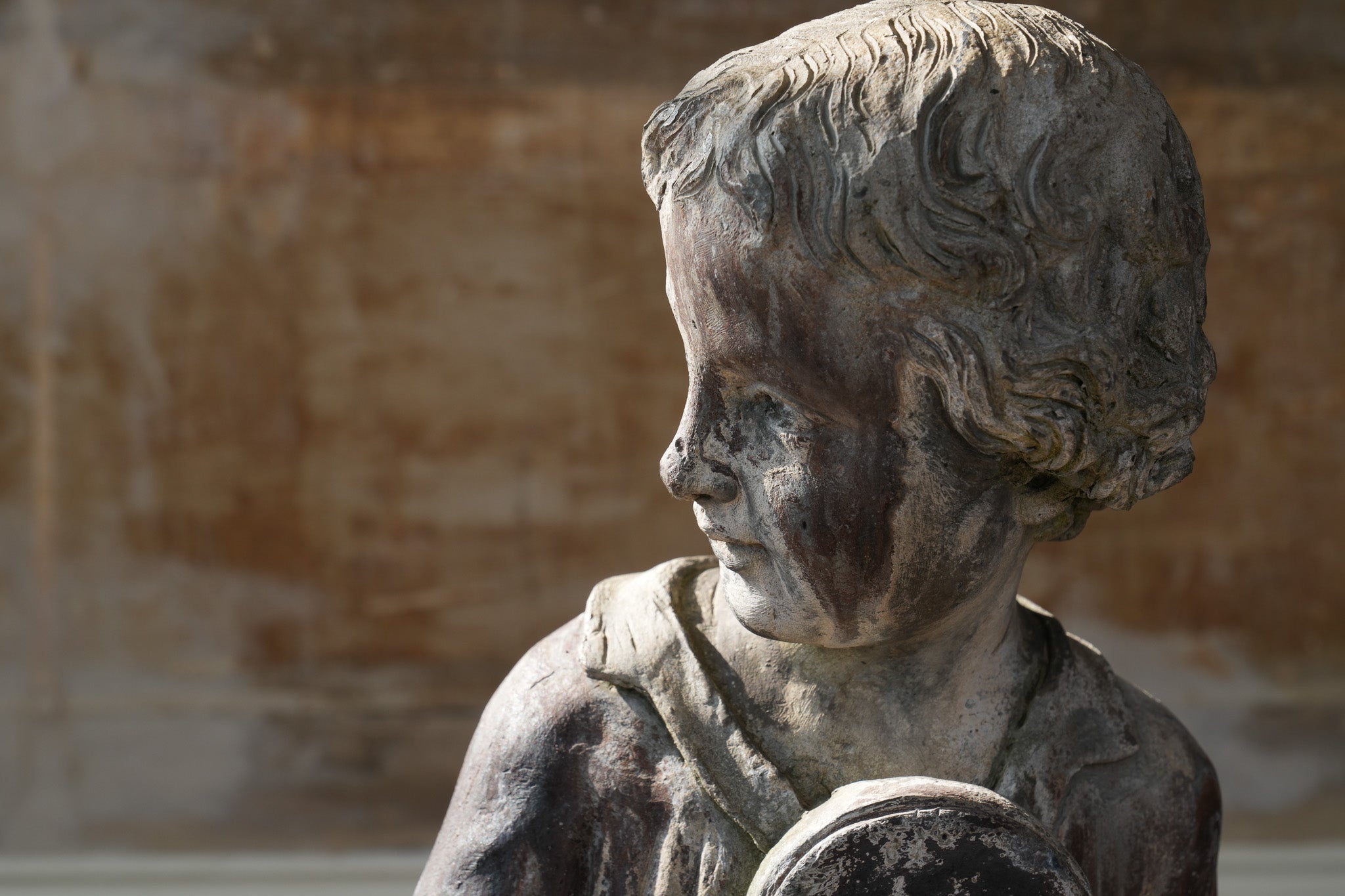 A Lead Statue of a Boy