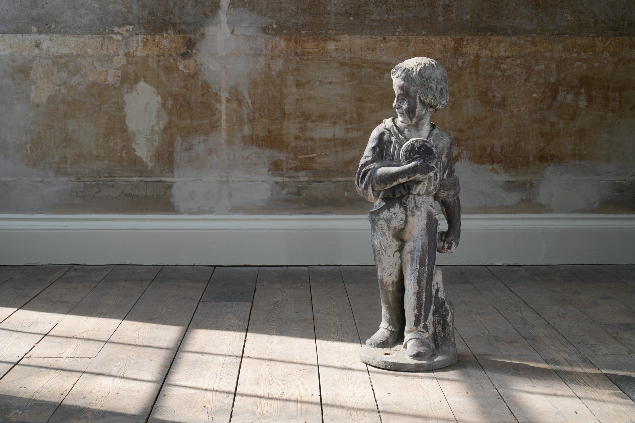 A Lead Statue of a Boy