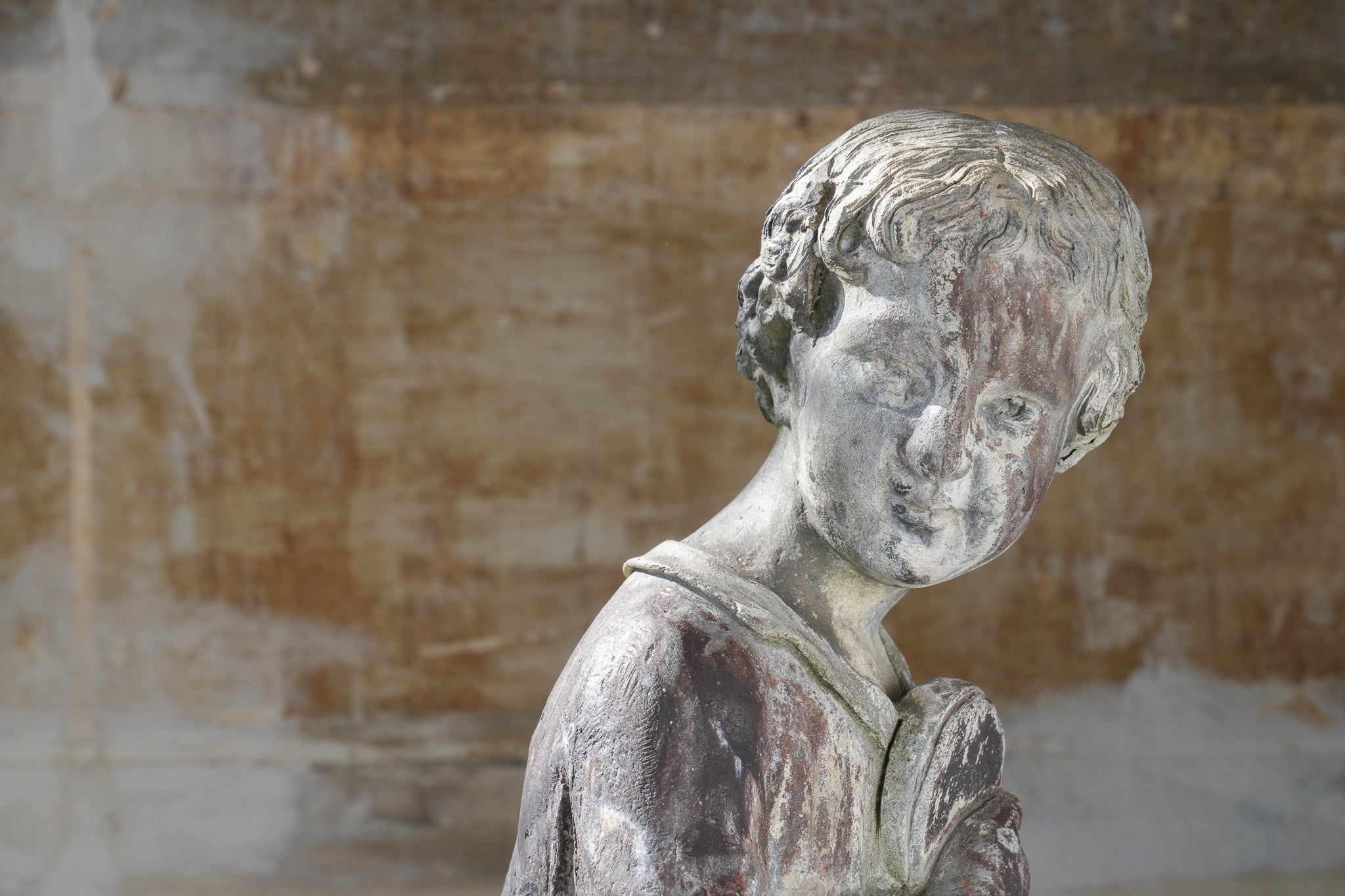 A Lead Statue of a Boy