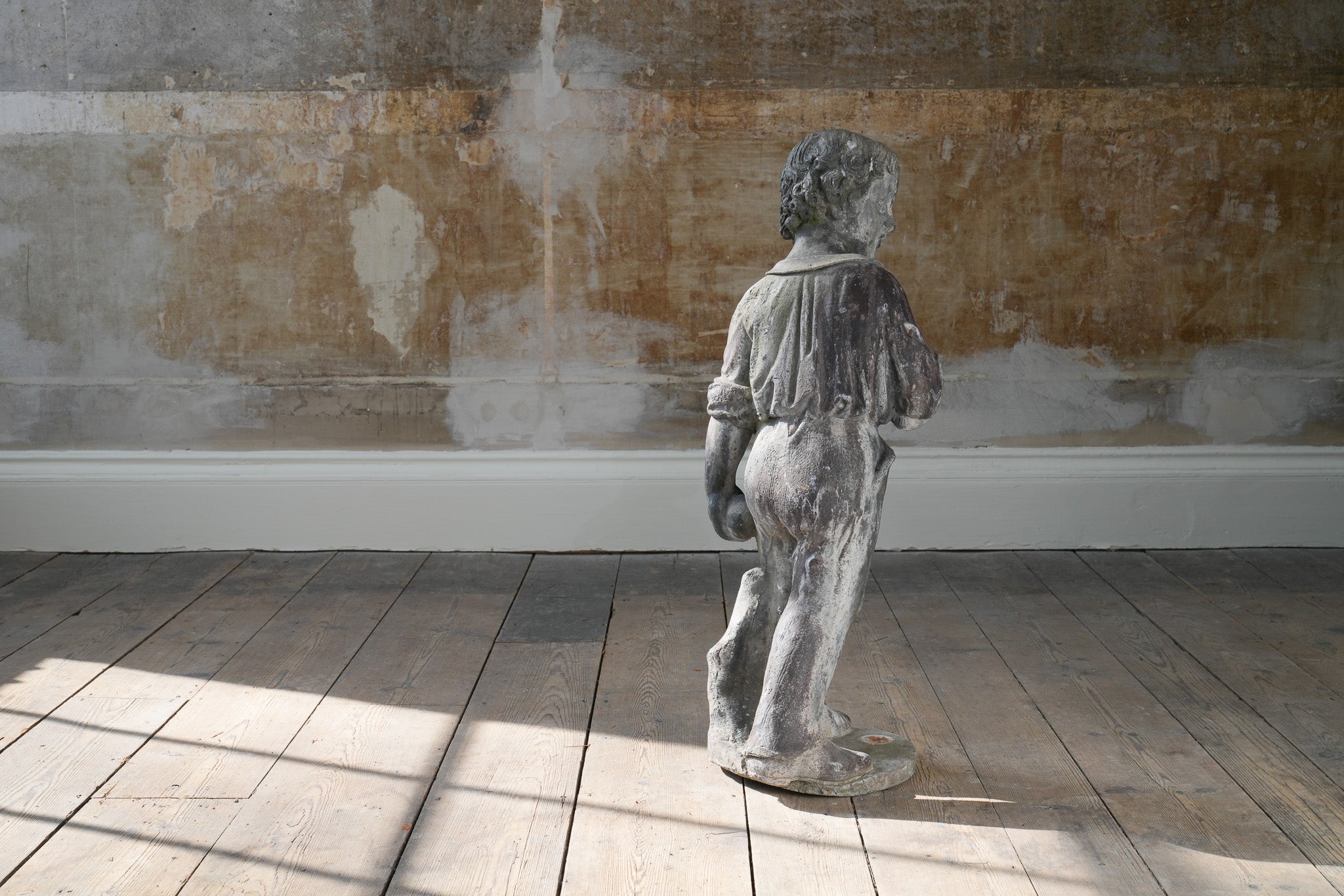 A Lead Statue of a Boy