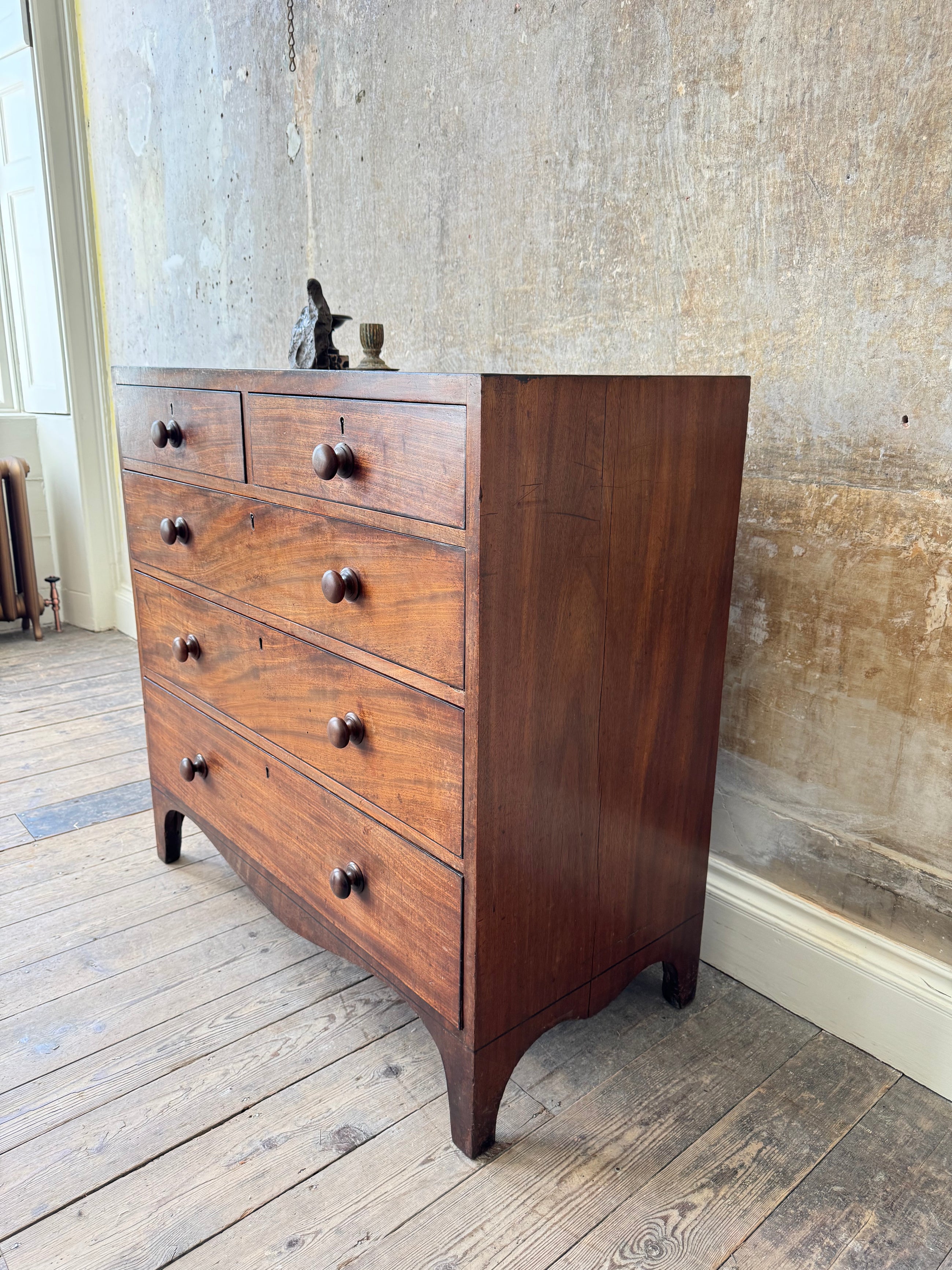 A George III Caddy-Topped Mahogany Chest Of Drawers