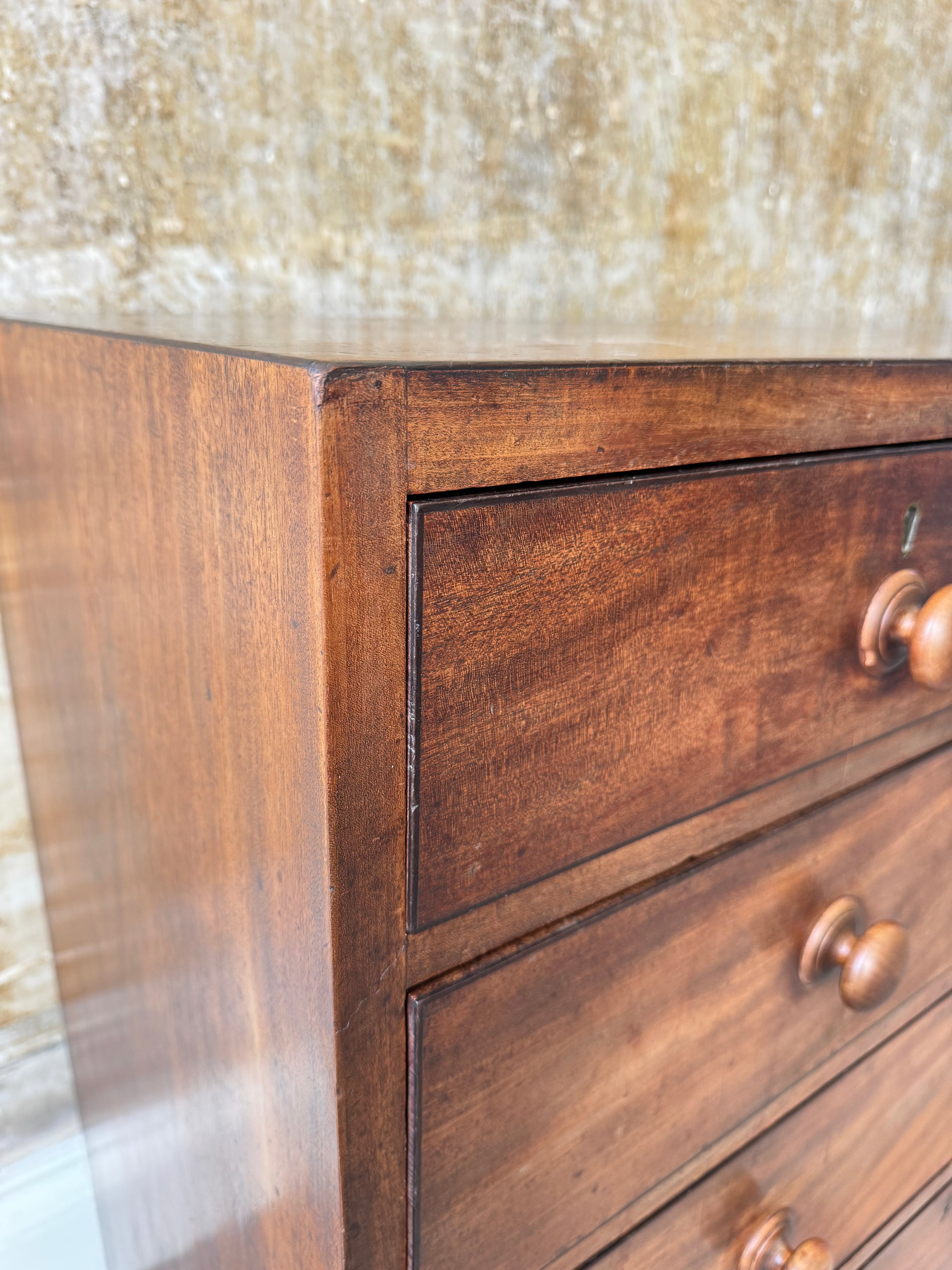 A George III Caddy-Topped Mahogany Chest Of Drawers