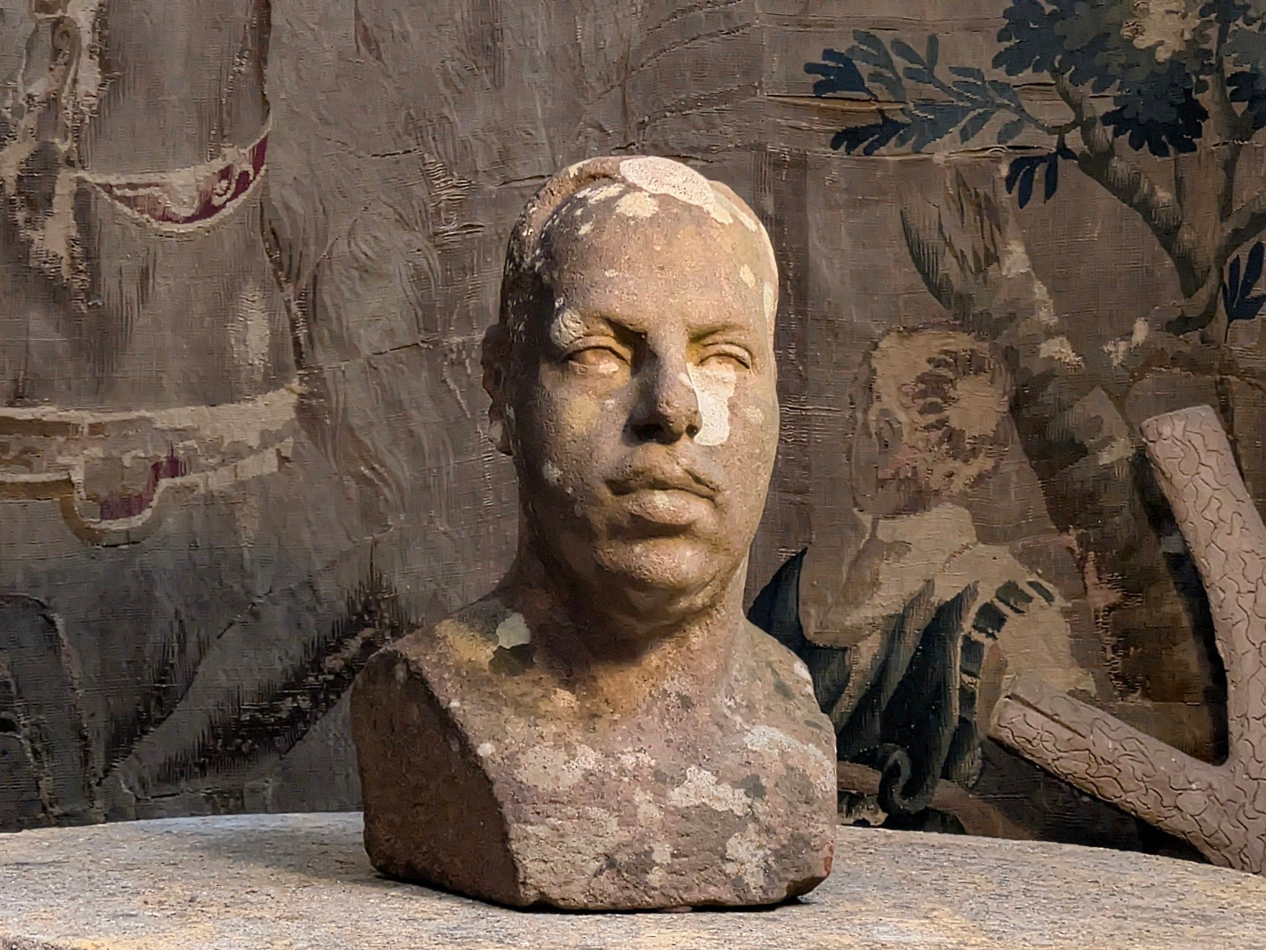 A Carved Stone Male Bust