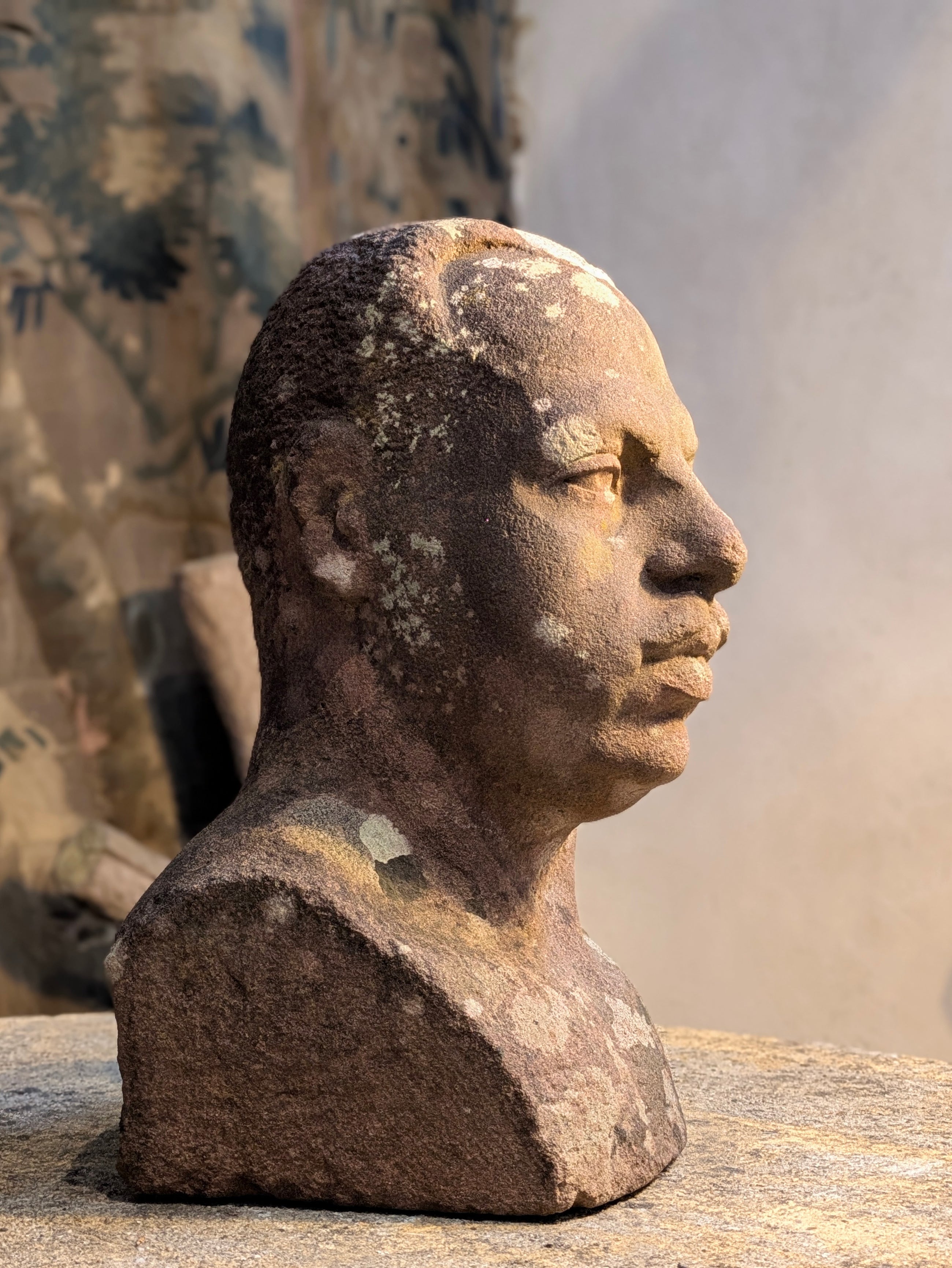 A Carved Stone Male Bust