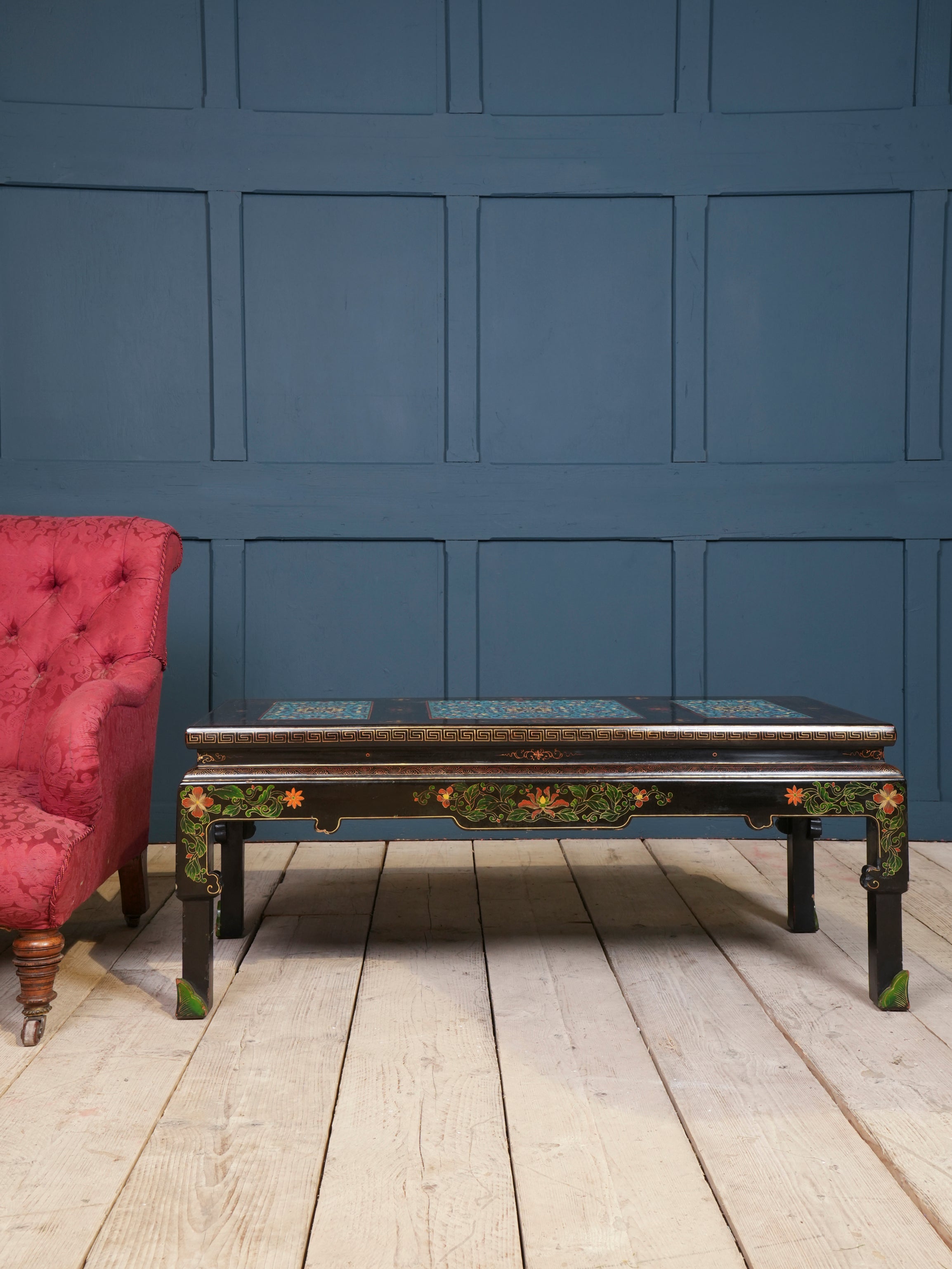An Ebonised Coffee Table with Inset Cloisonne Panel