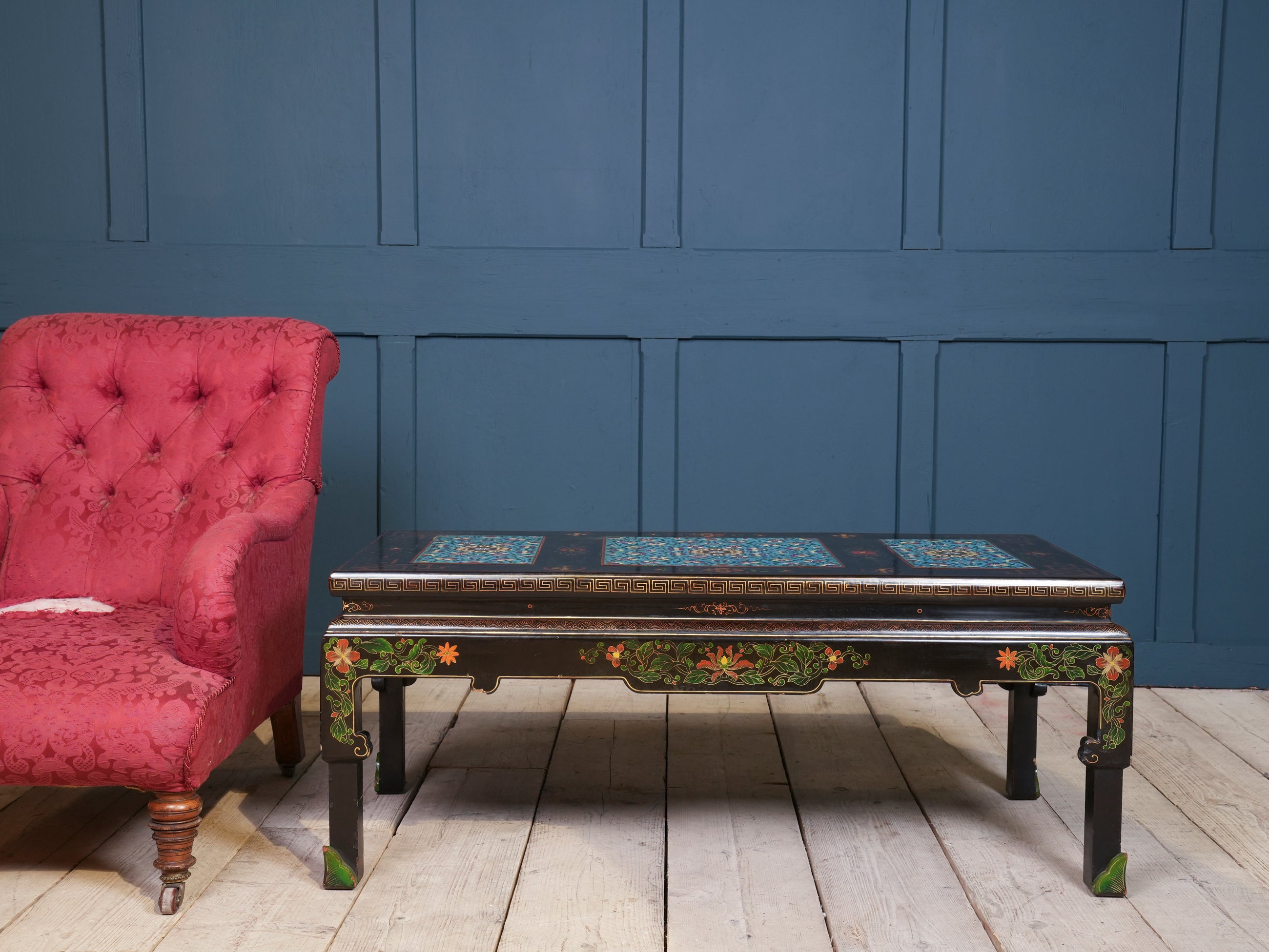 An Ebonised Coffee Table with Inset Cloisonne Panel