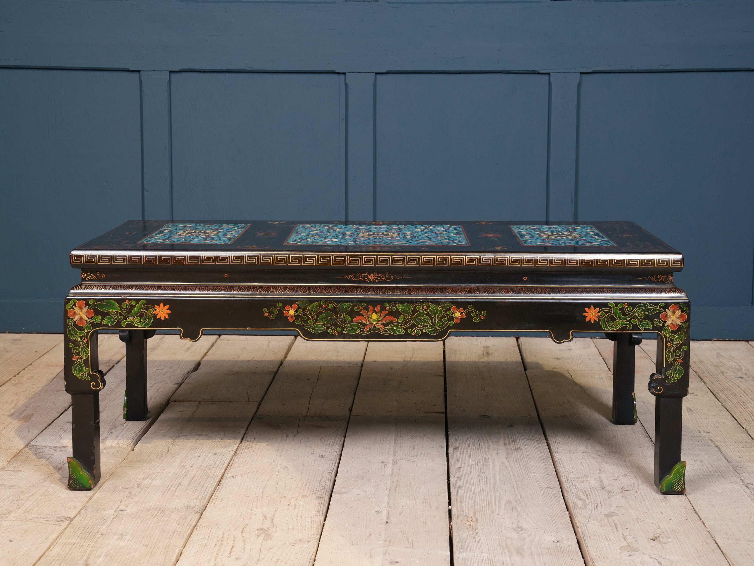 An Ebonised Coffee Table with Inset Cloisonne Panel