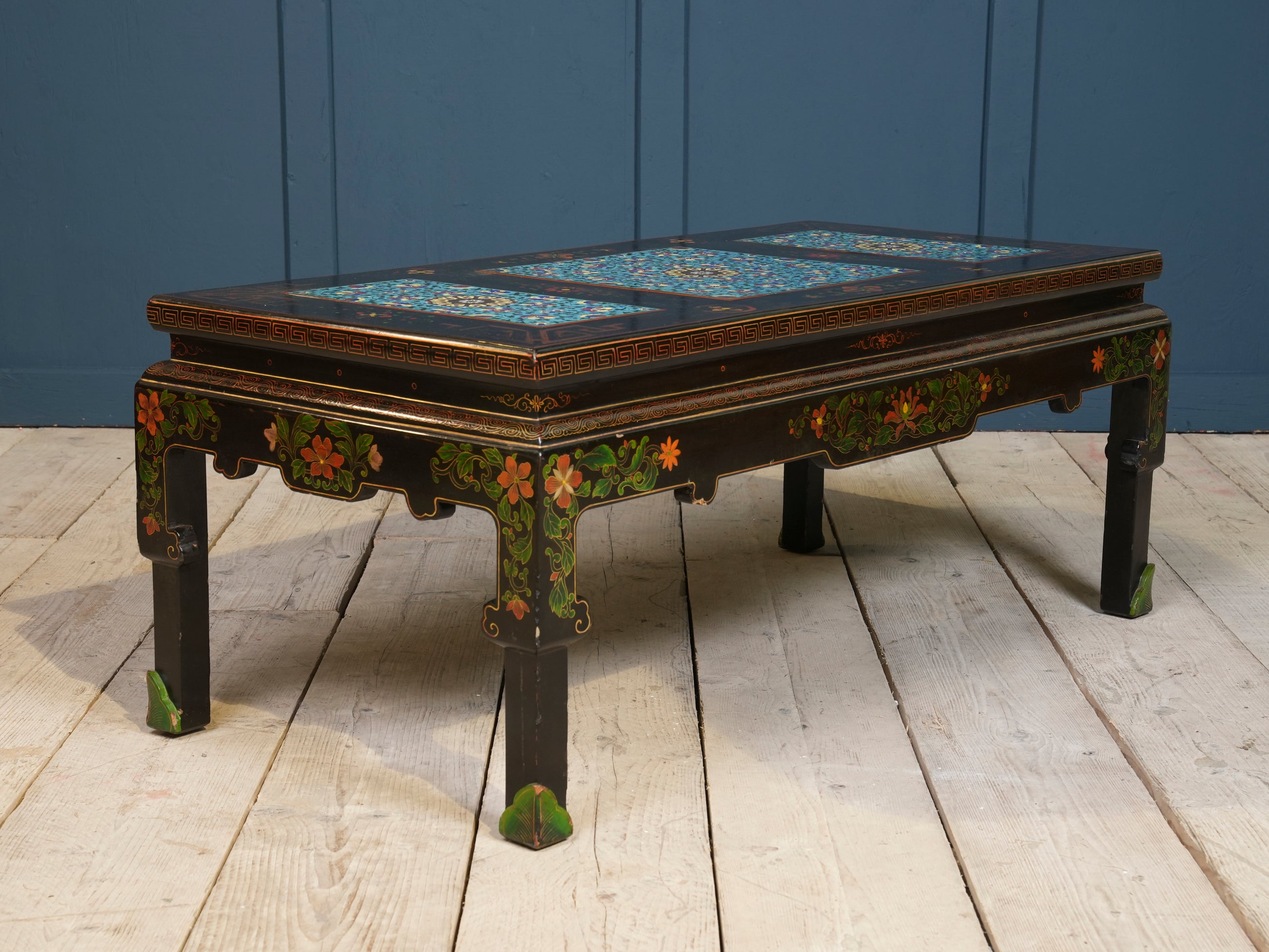 An Ebonised Coffee Table with Inset Cloisonne Panel