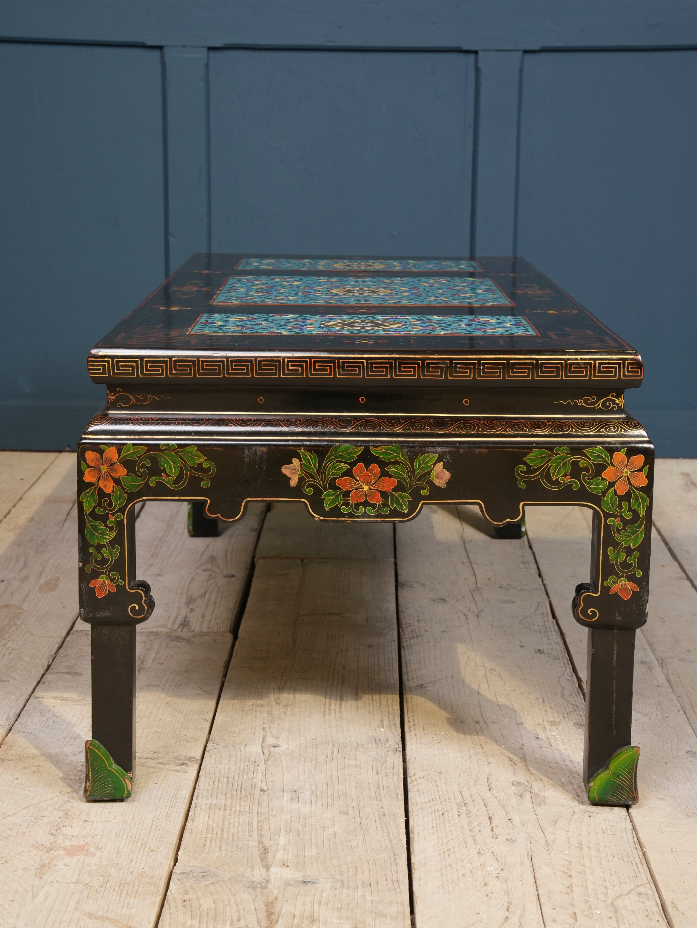 An Ebonised Coffee Table with Inset Cloisonne Panel