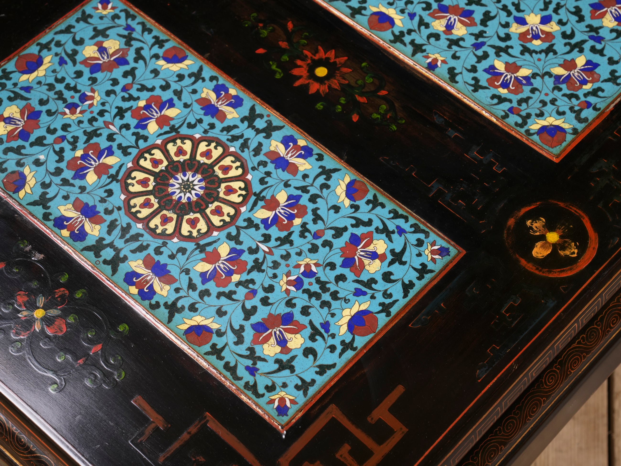 An Ebonised Coffee Table with Inset Cloisonne Panel