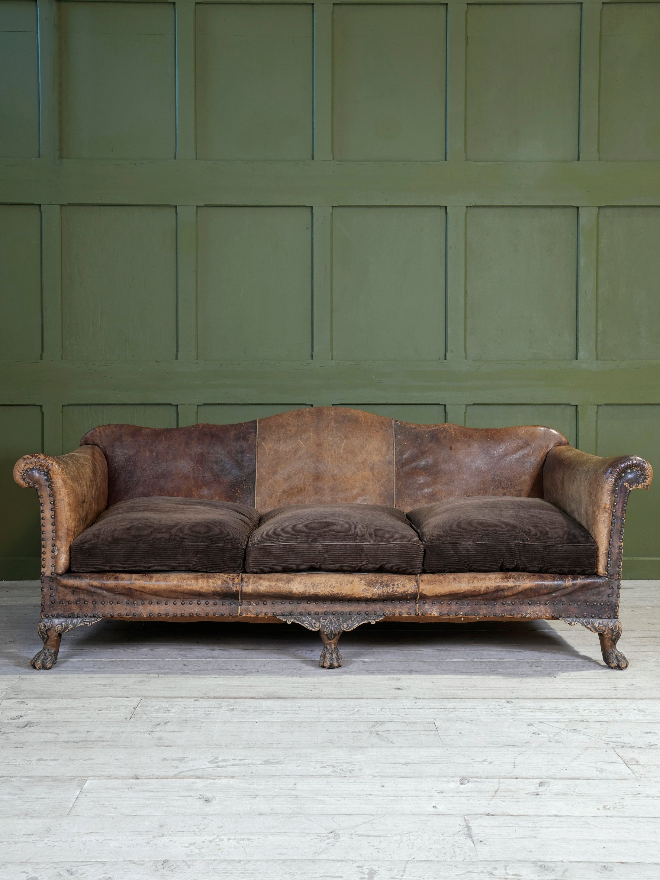 A Large Leather Camelback Sofa
