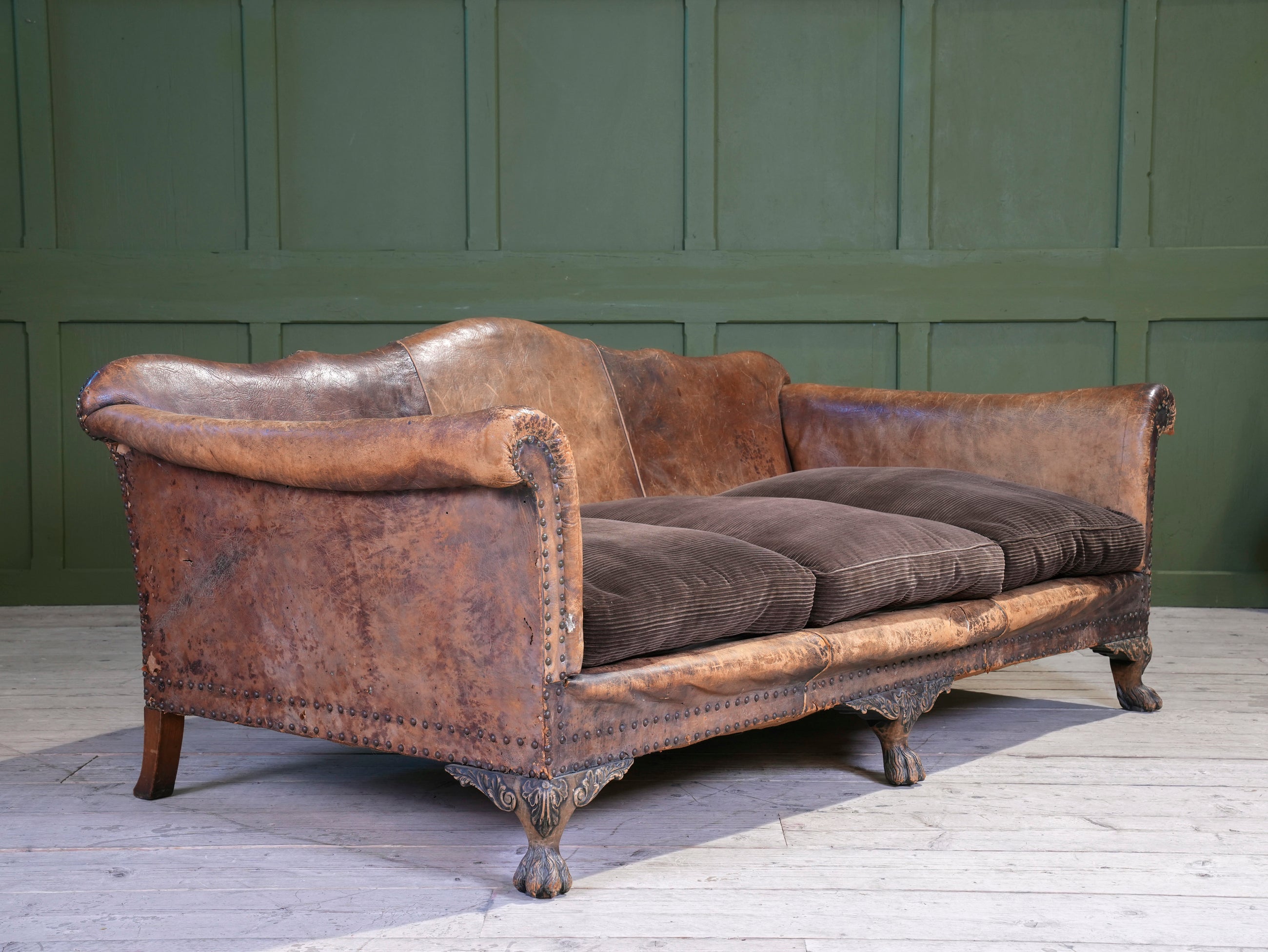 A Large Leather Camelback Sofa