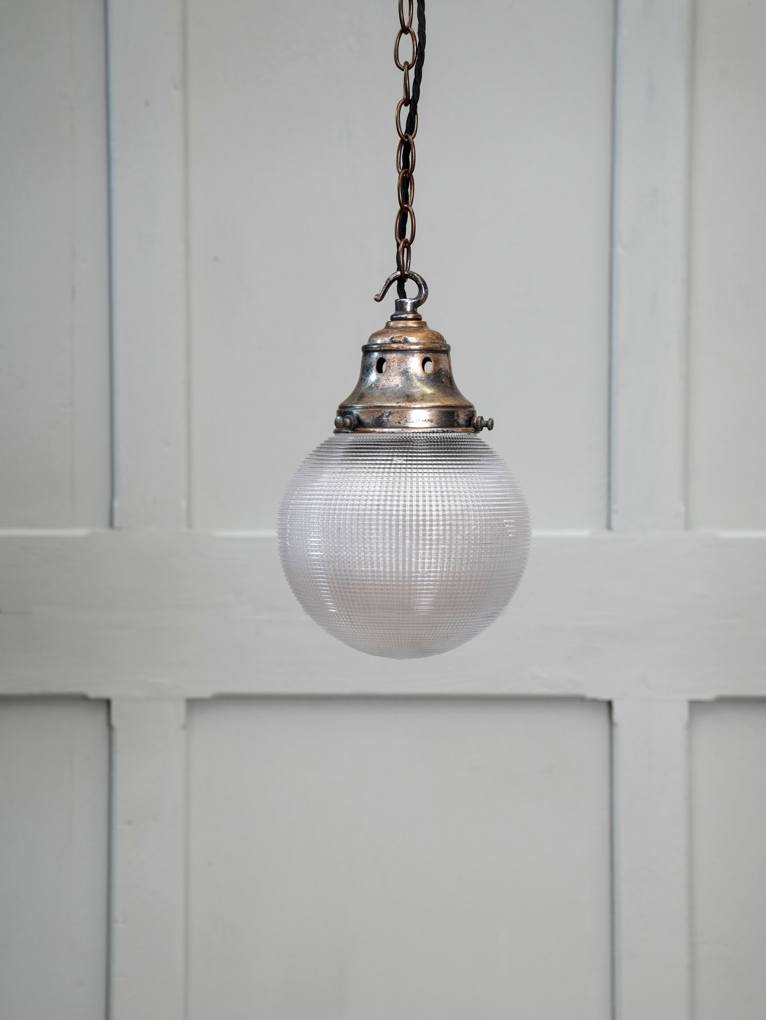 A Single Holophane Globe Pendant Light