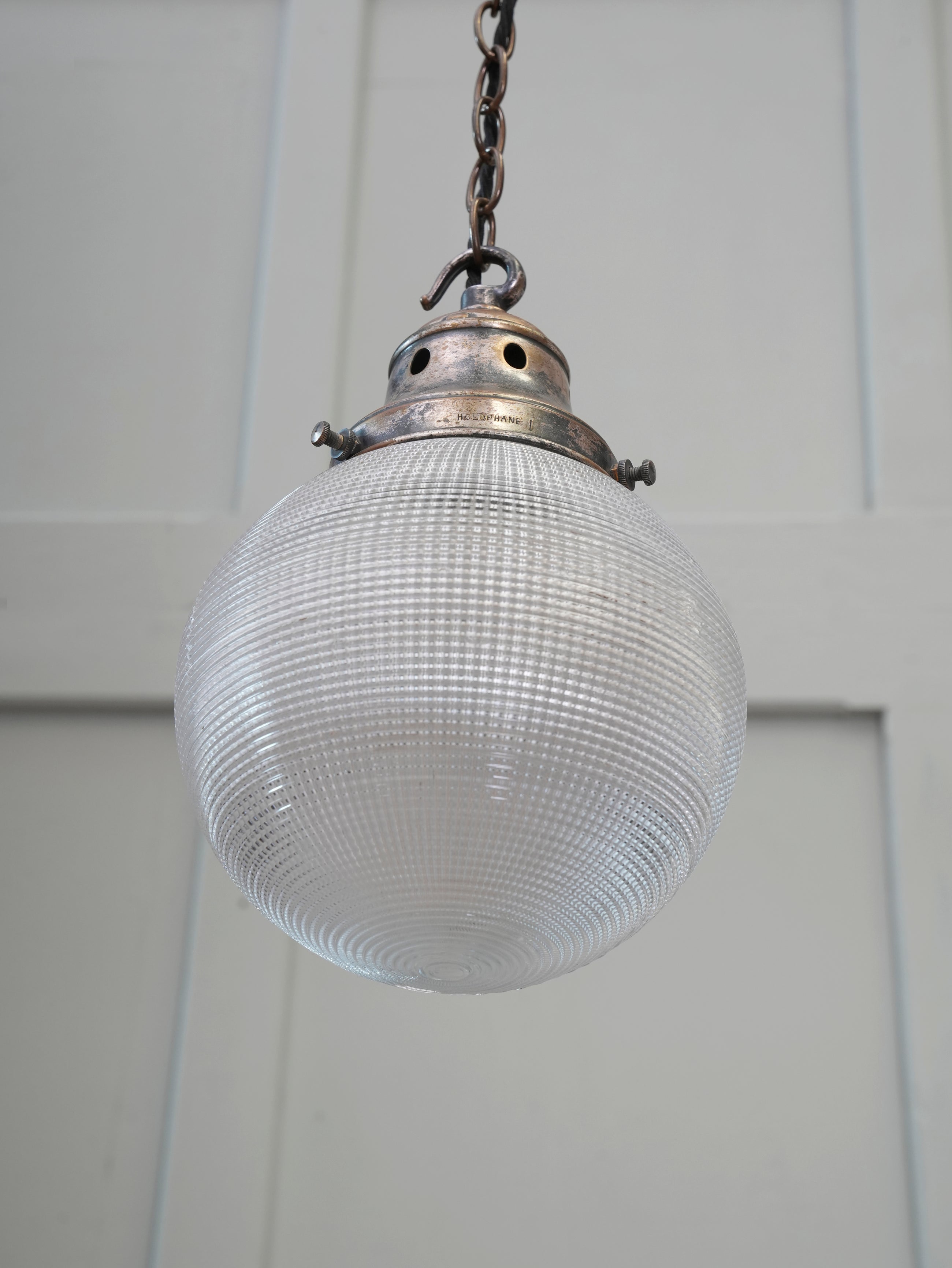 A Single Holophane Globe Pendant Light