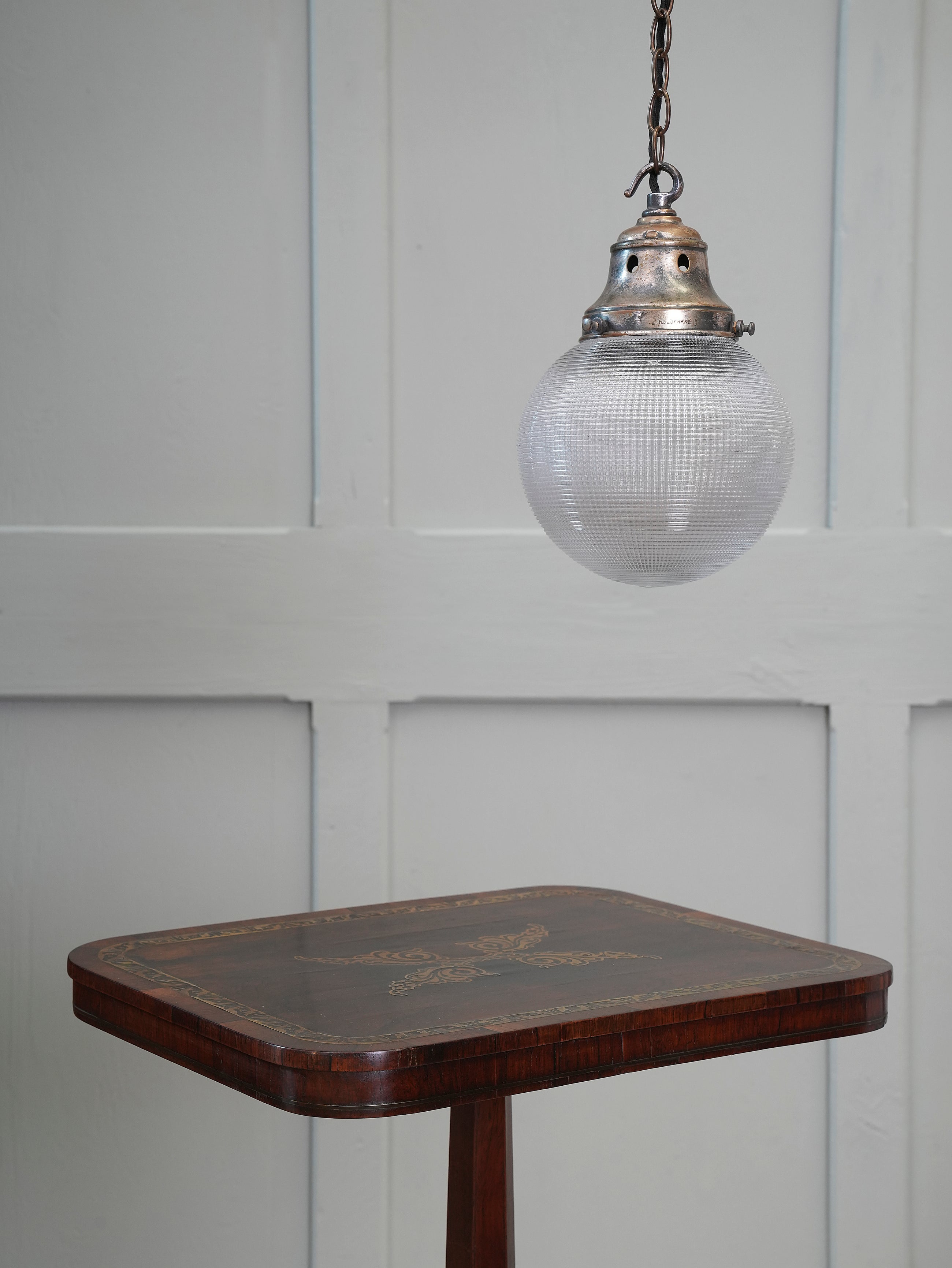 A Single Holophane Globe Pendant Light