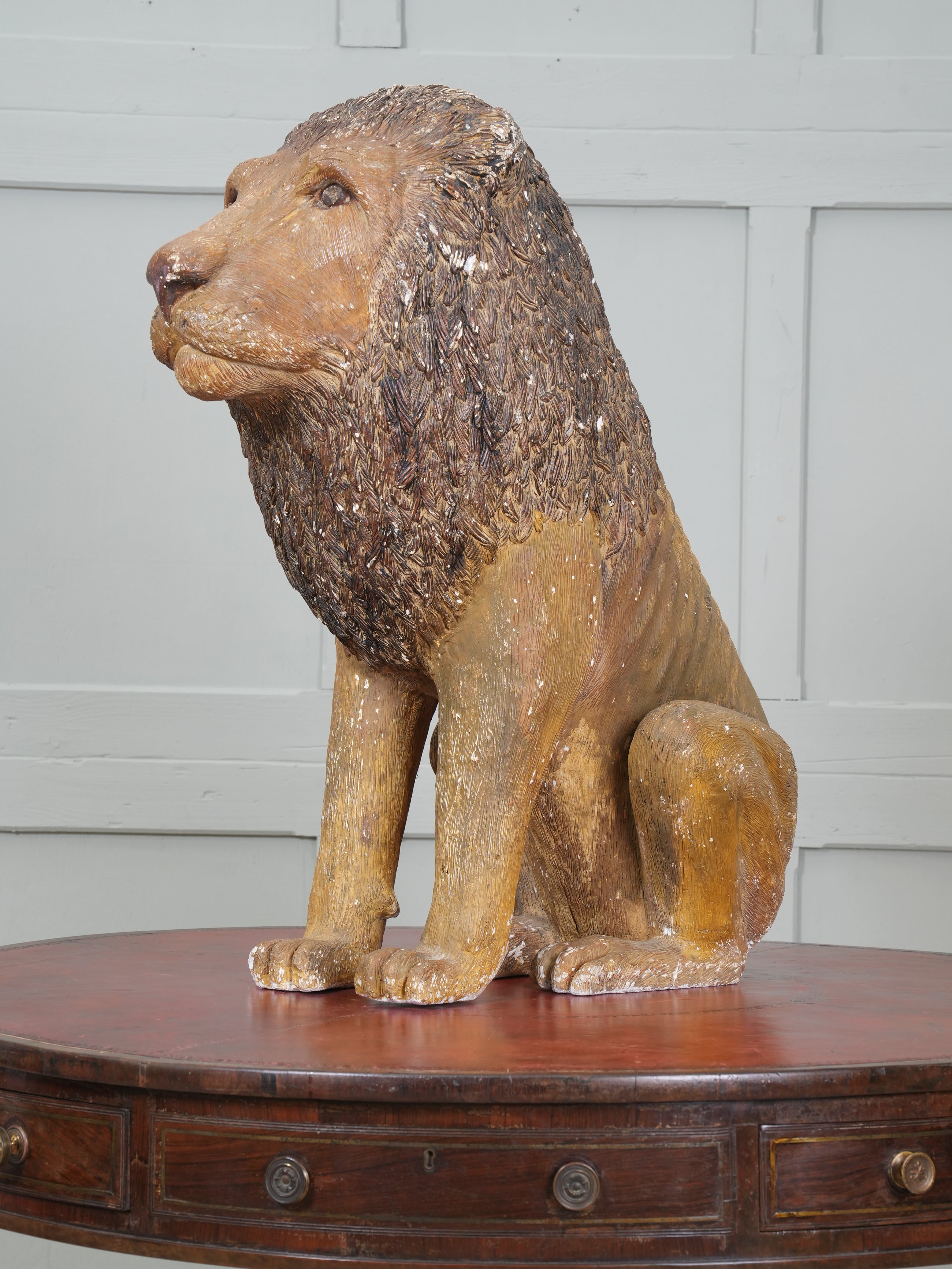 A Painted Plaster Seated Lion