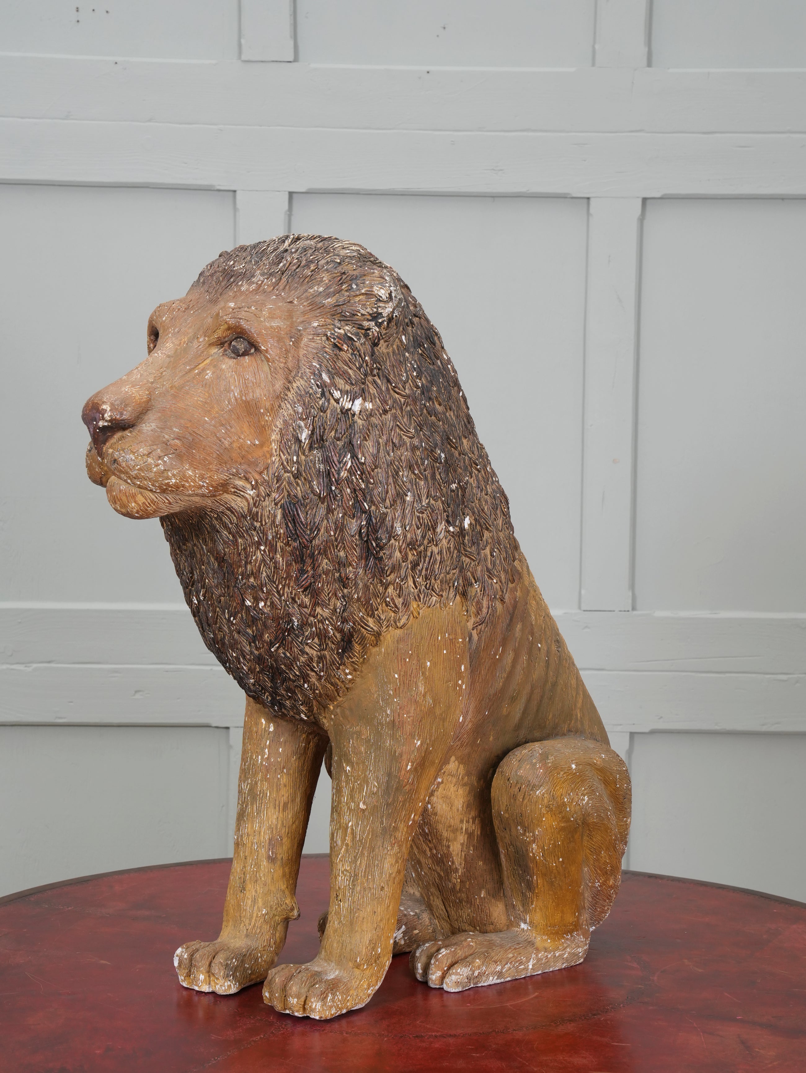 A Painted Plaster Seated Lion