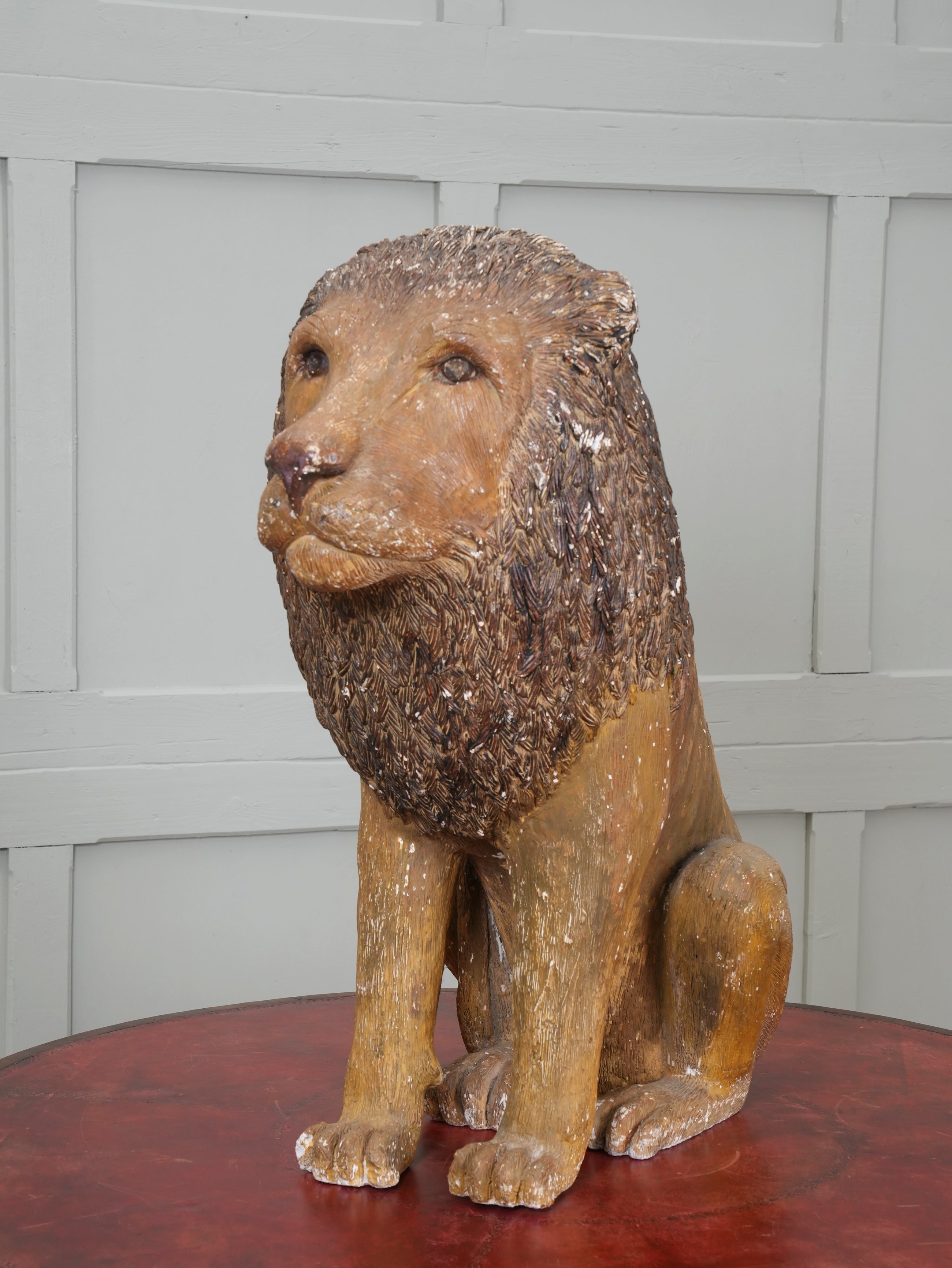 A Painted Plaster Seated Lion