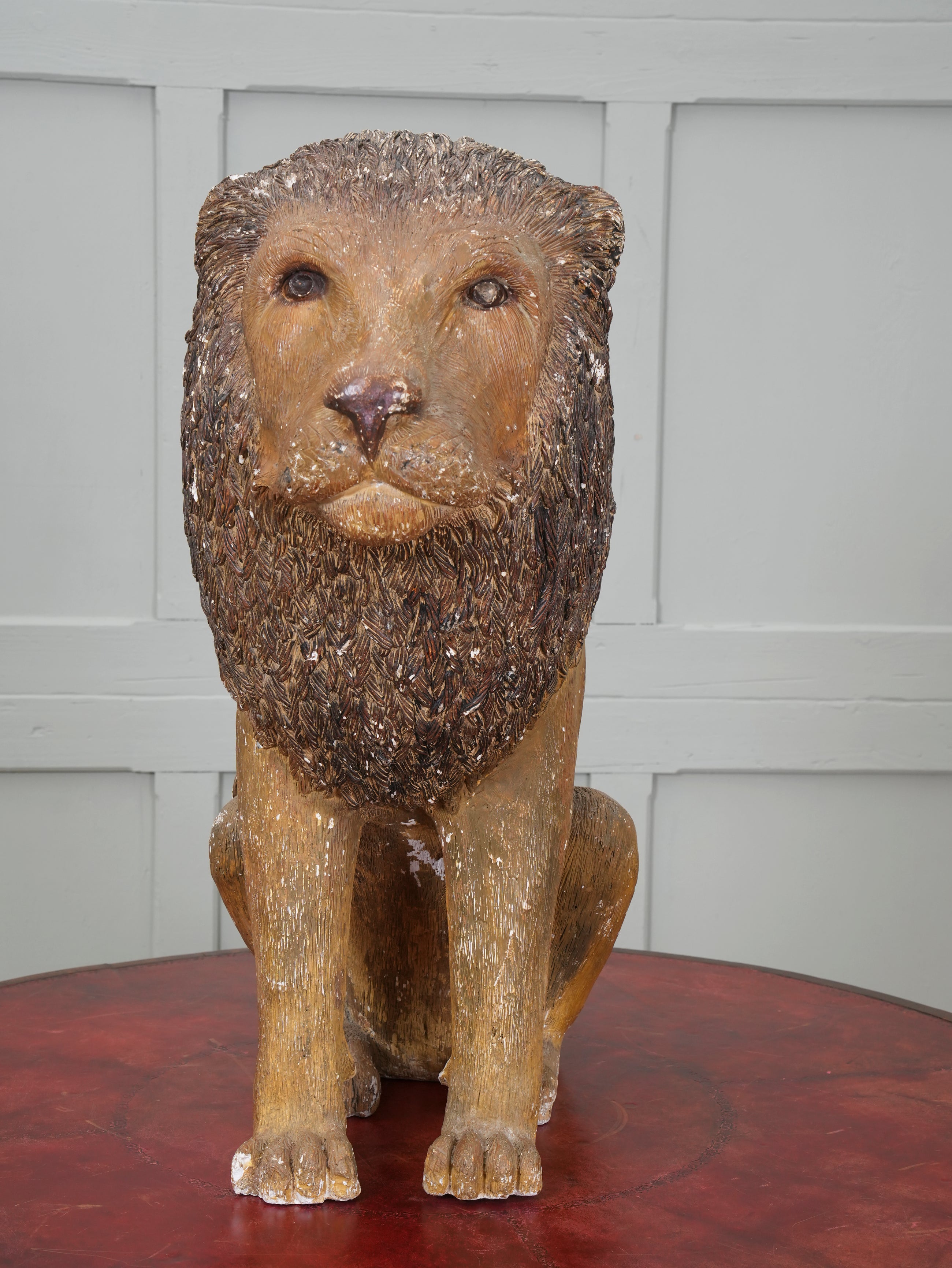 A Painted Plaster Seated Lion