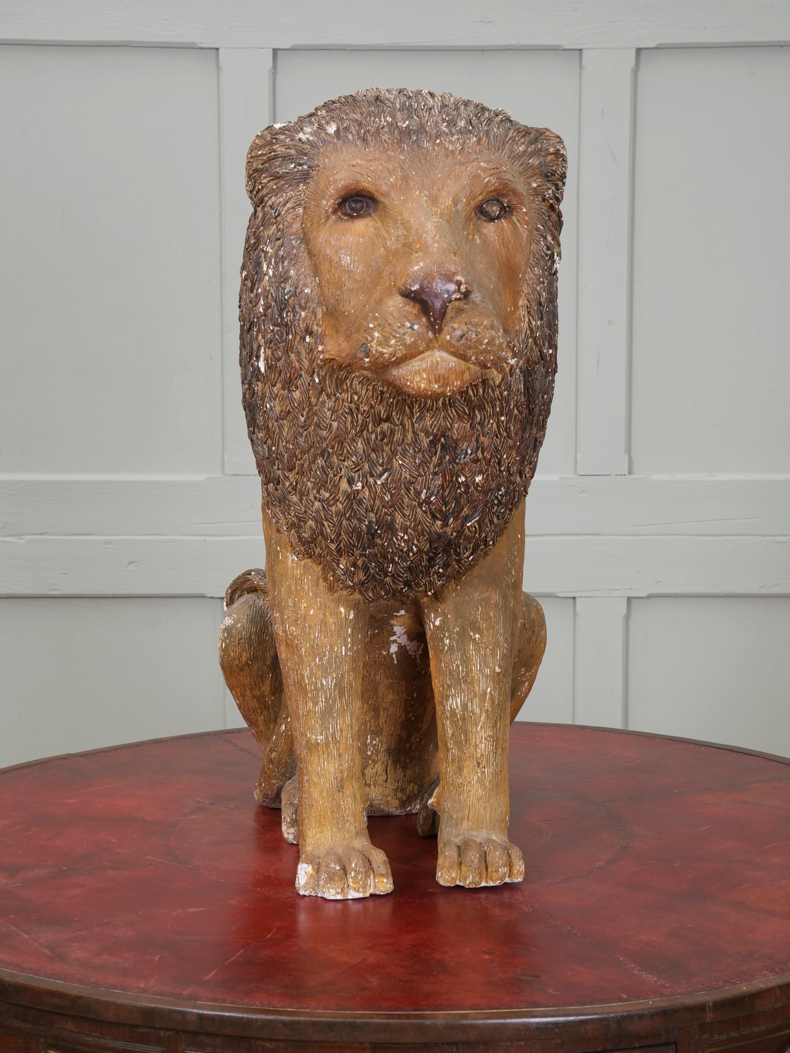 A Painted Plaster Seated Lion