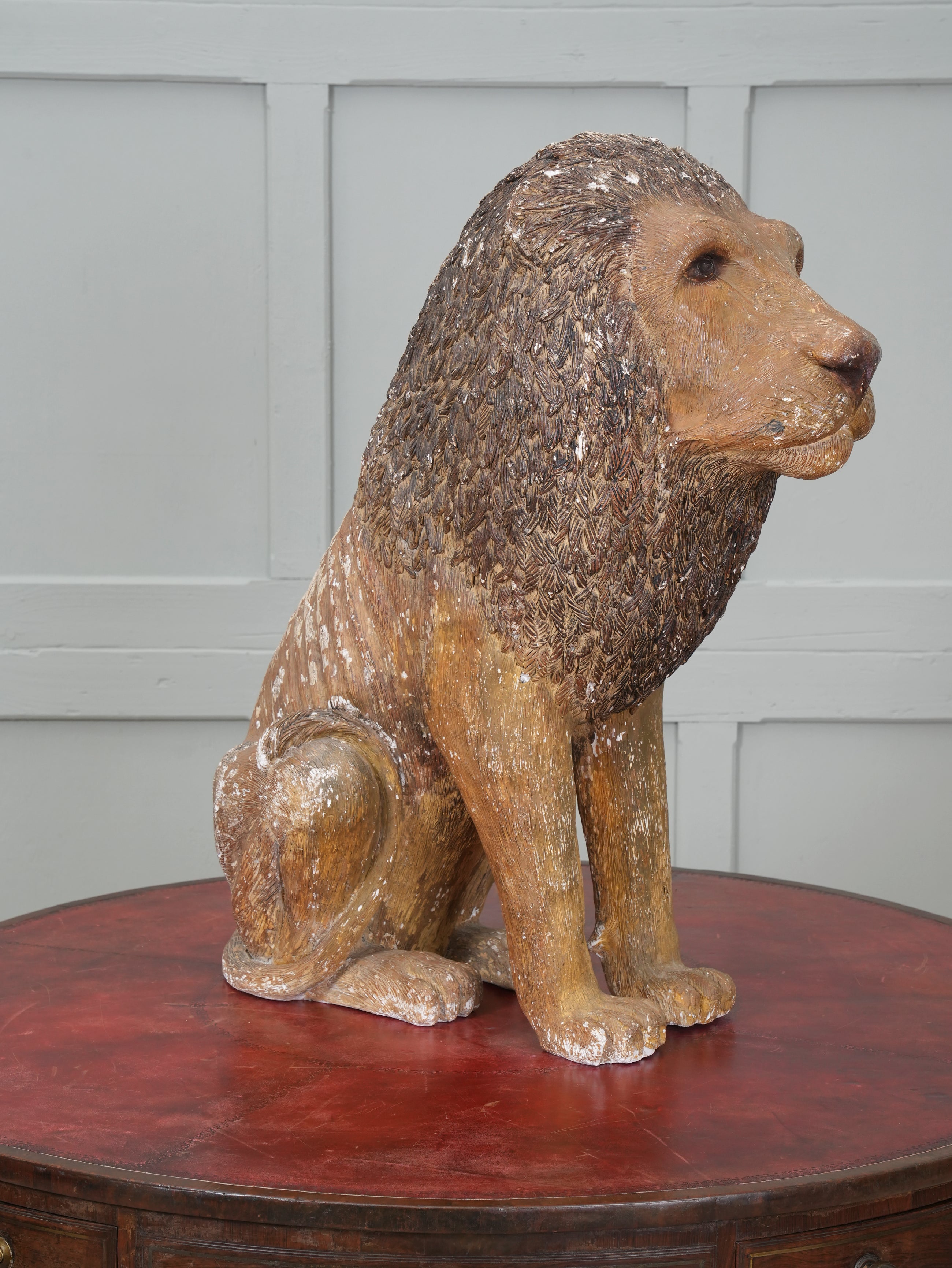 A Painted Plaster Seated Lion