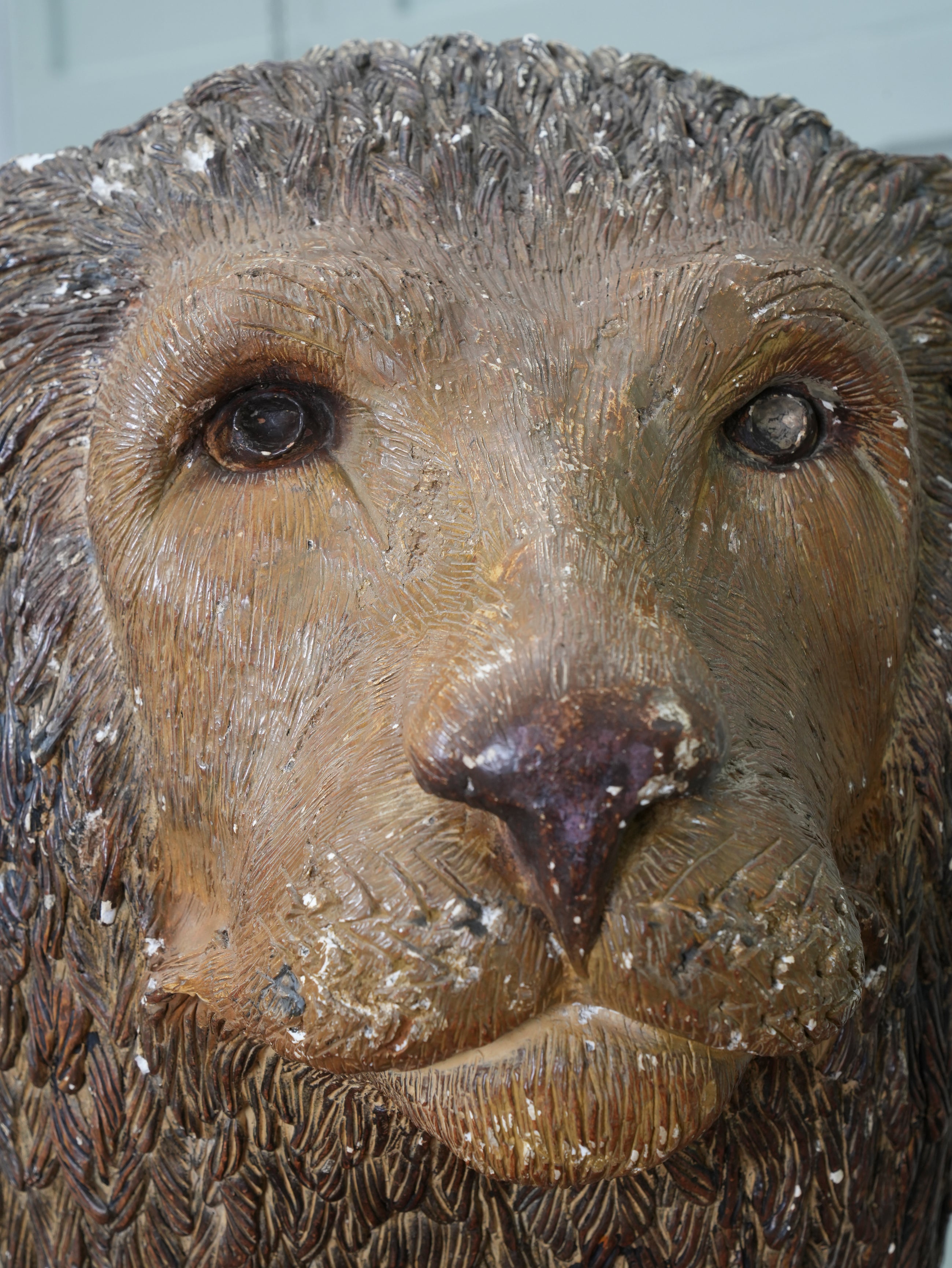 A Painted Plaster Seated Lion