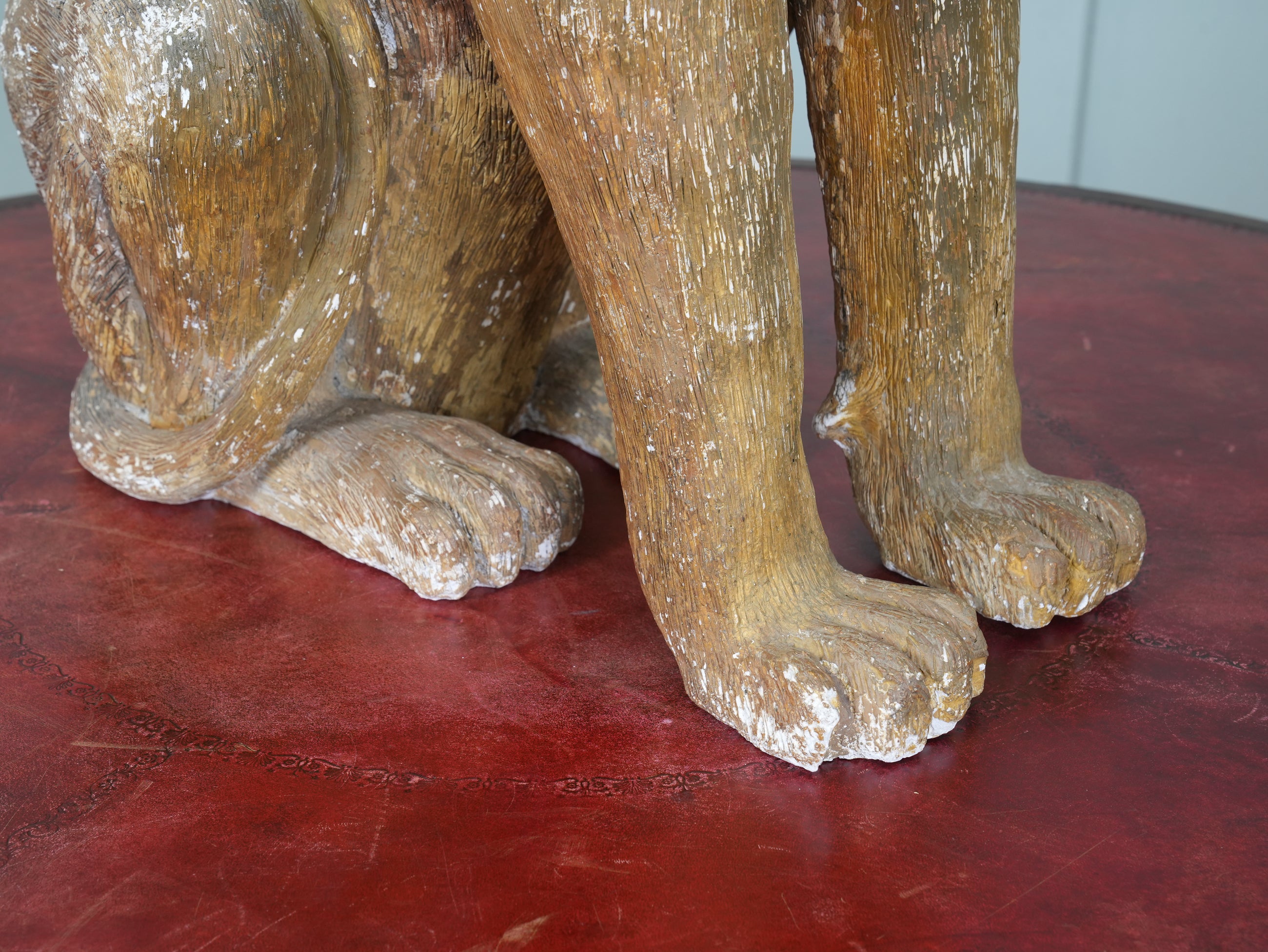 A Painted Plaster Seated Lion