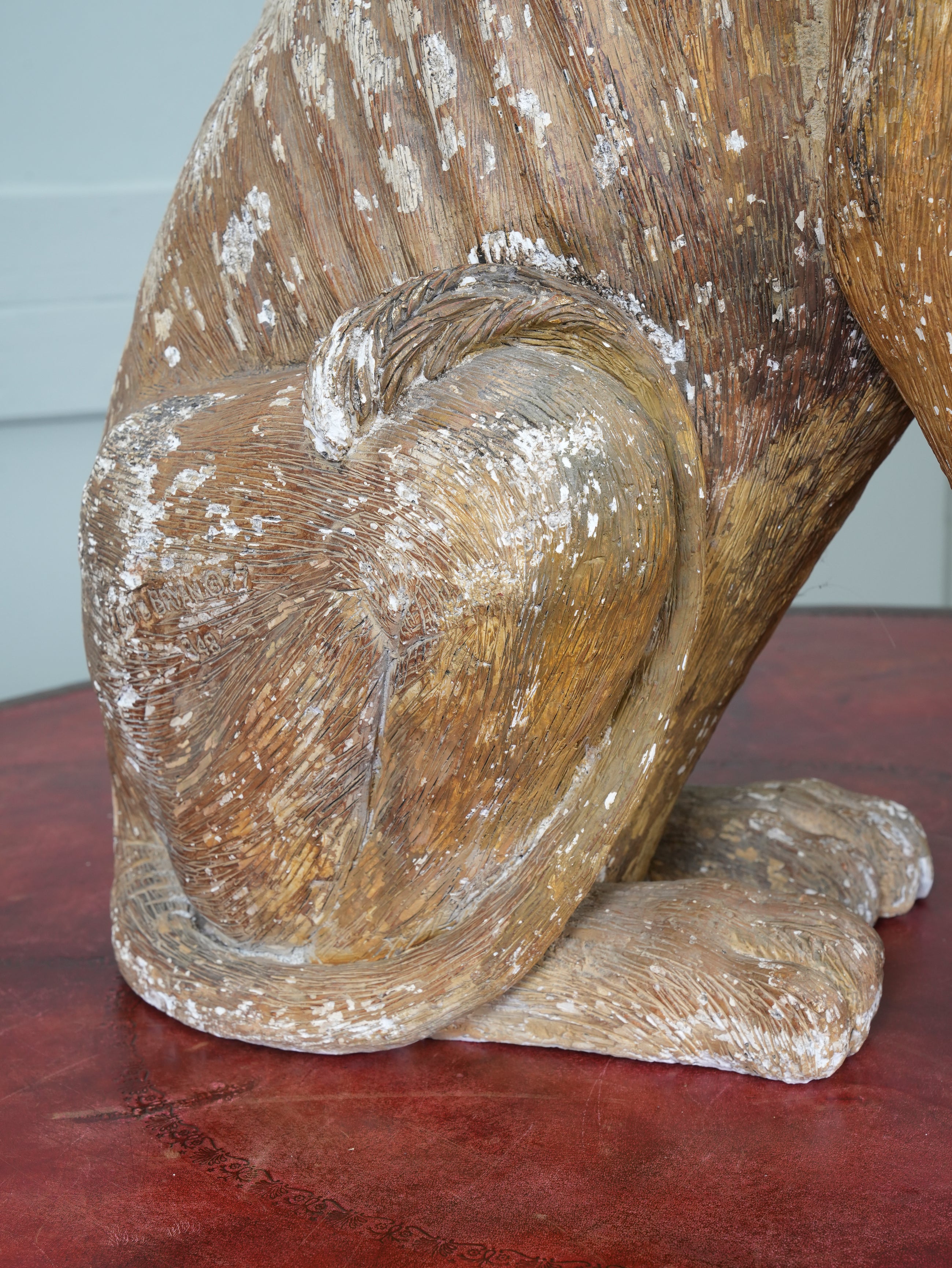 A Painted Plaster Seated Lion