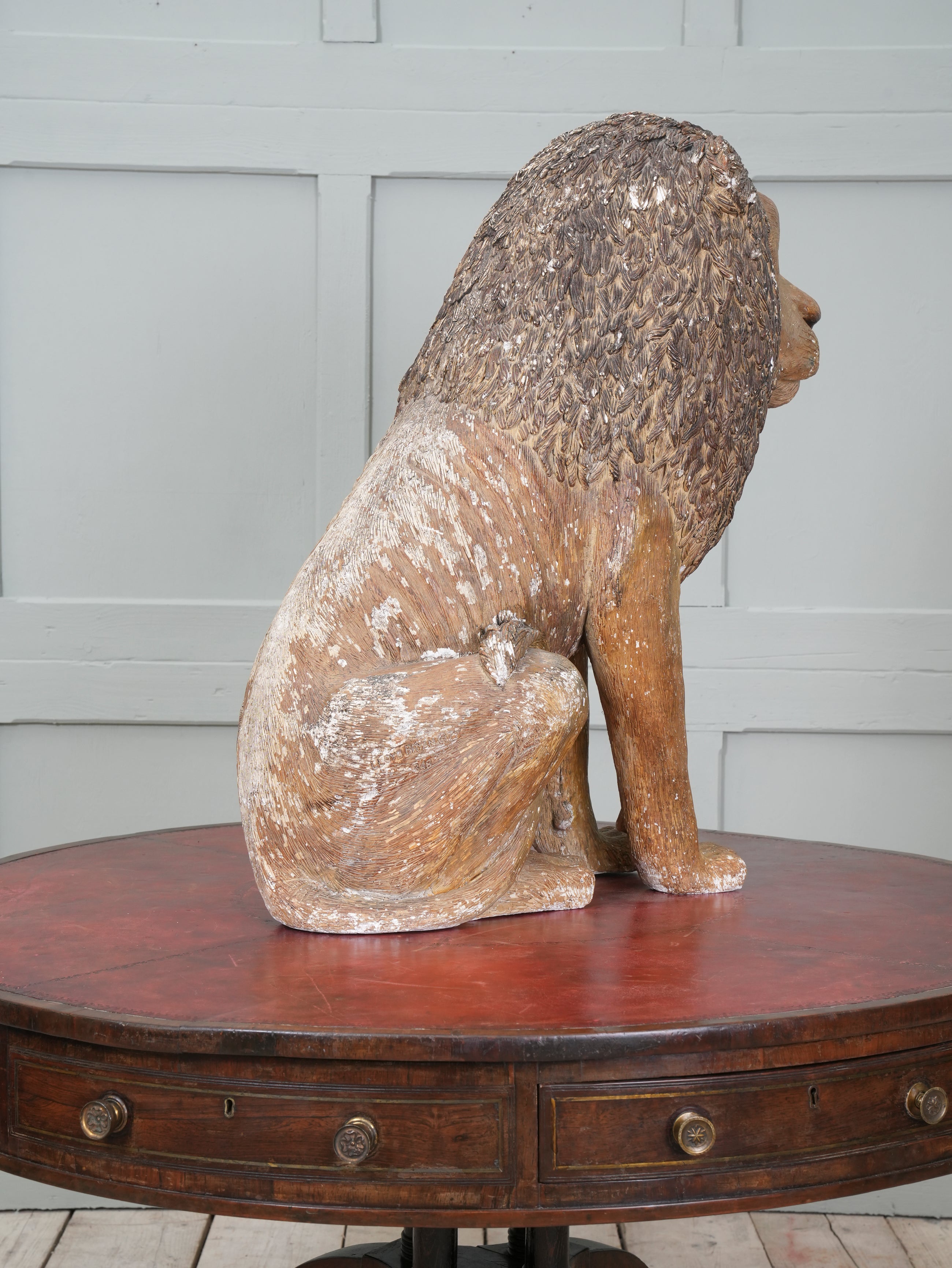 A Painted Plaster Seated Lion