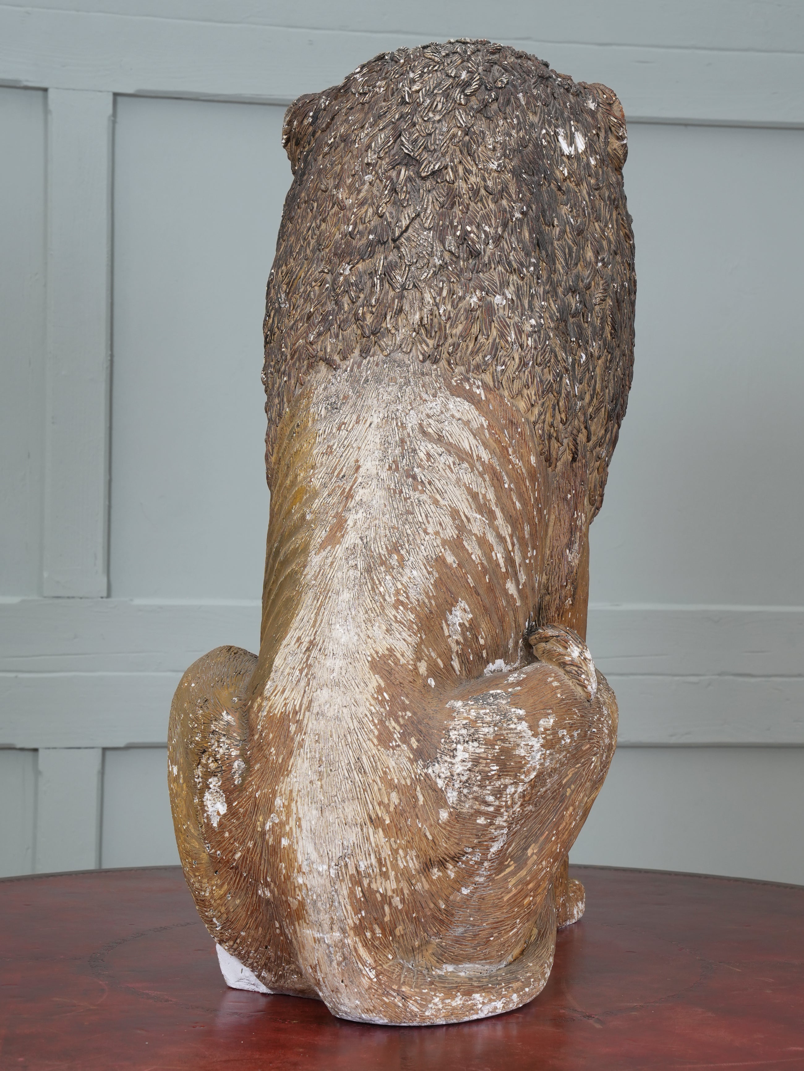 A Painted Plaster Seated Lion