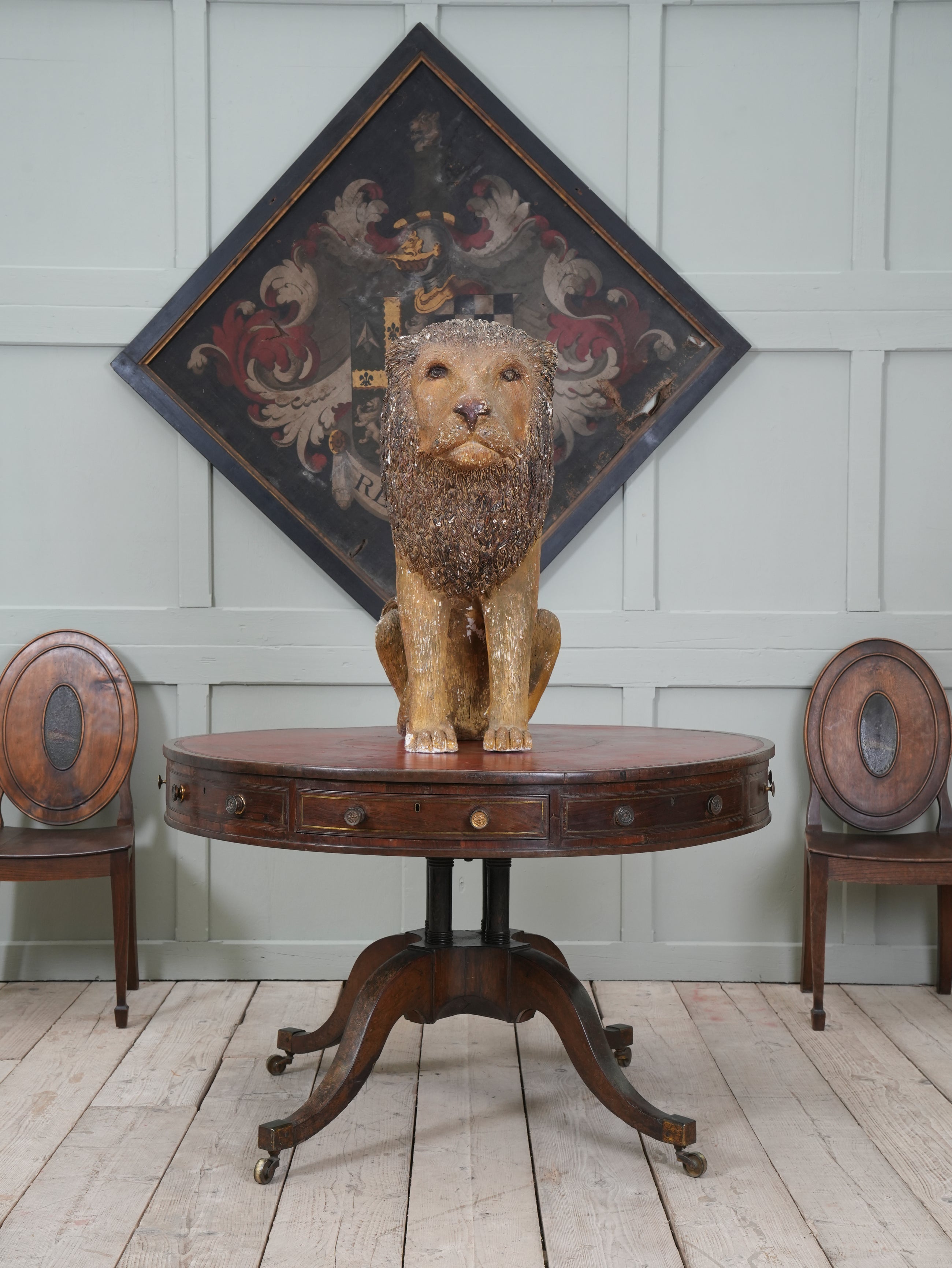 A Painted Plaster Seated Lion