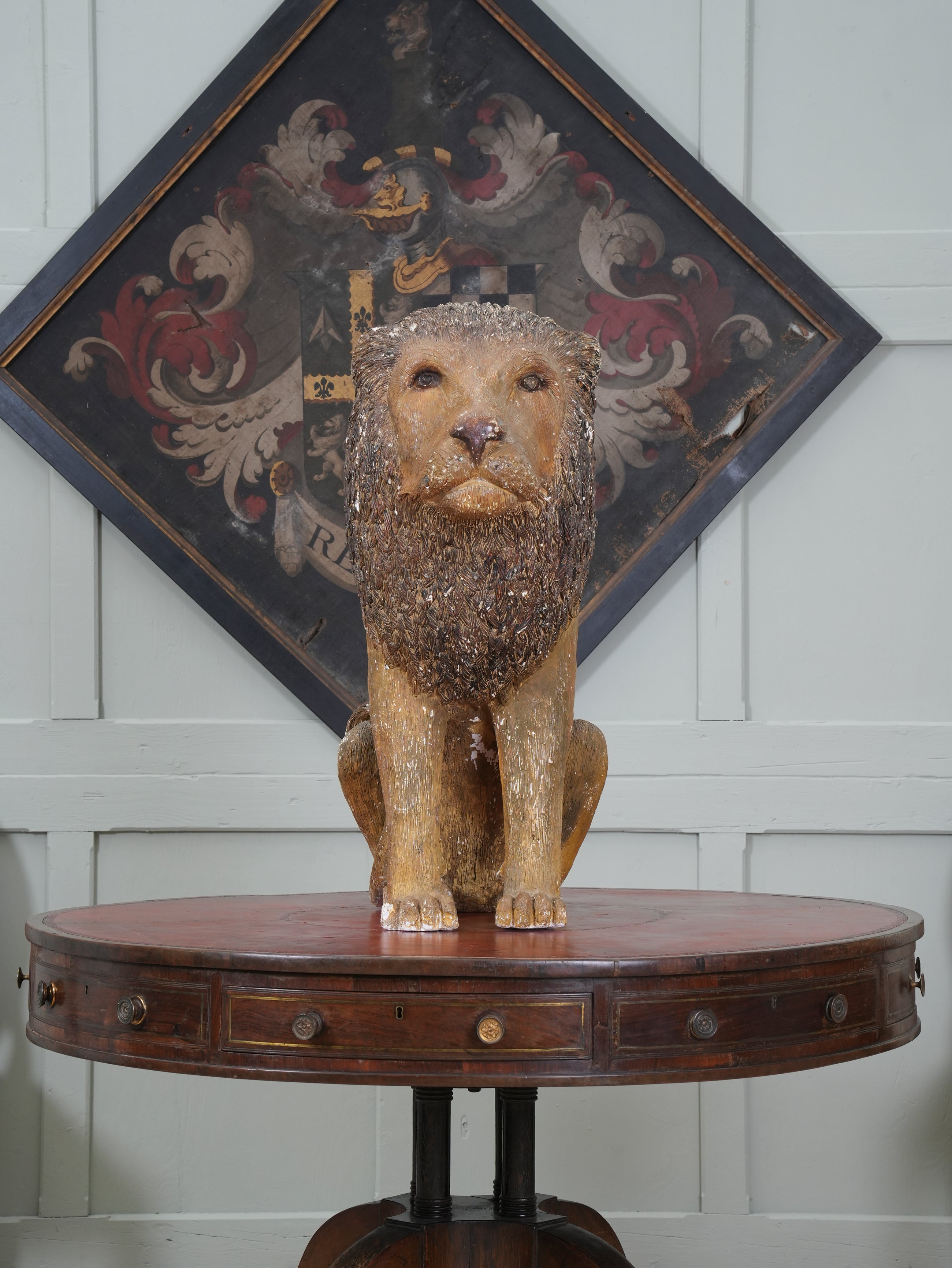 A Painted Plaster Seated Lion
