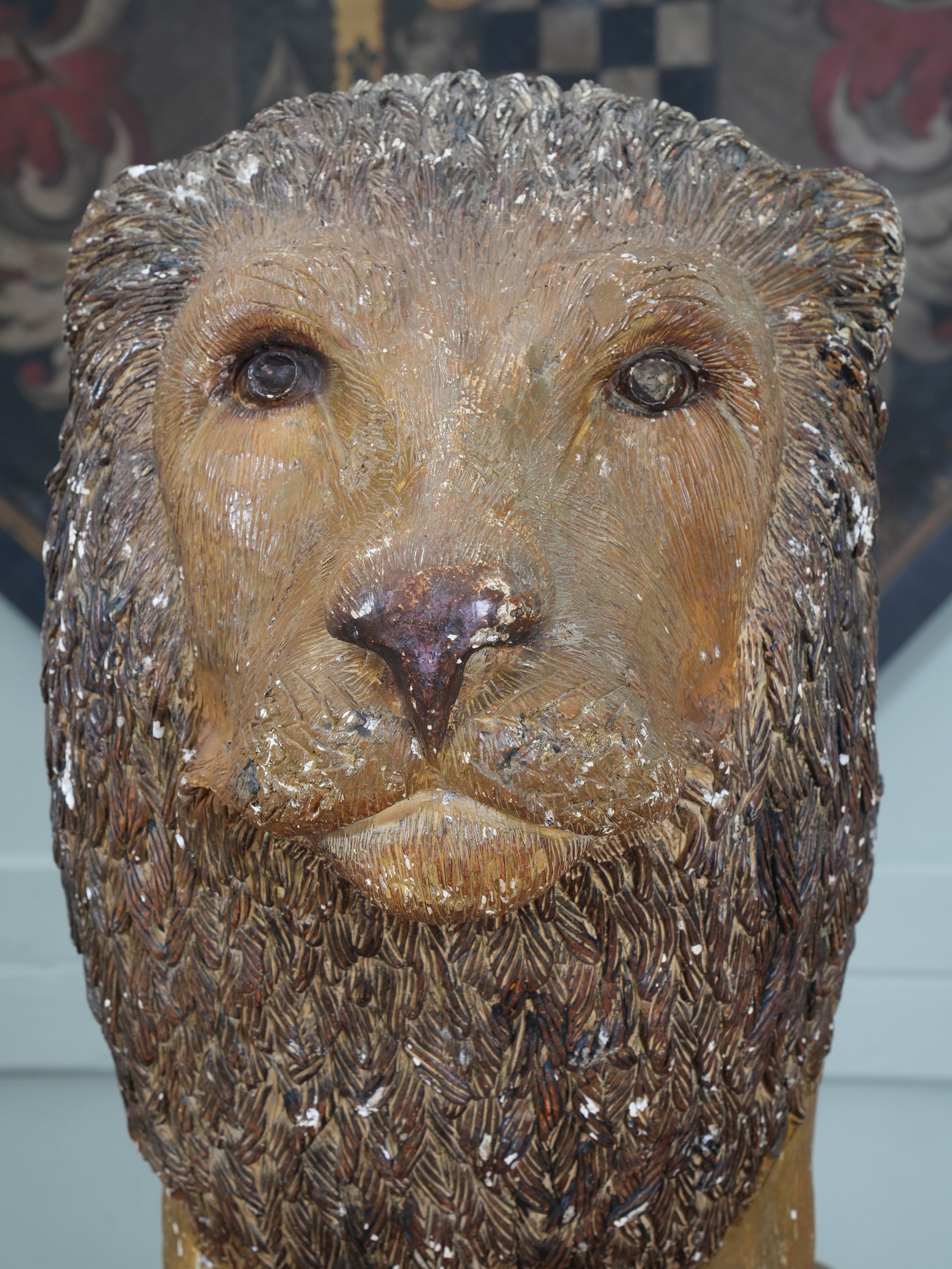 A Painted Plaster Seated Lion