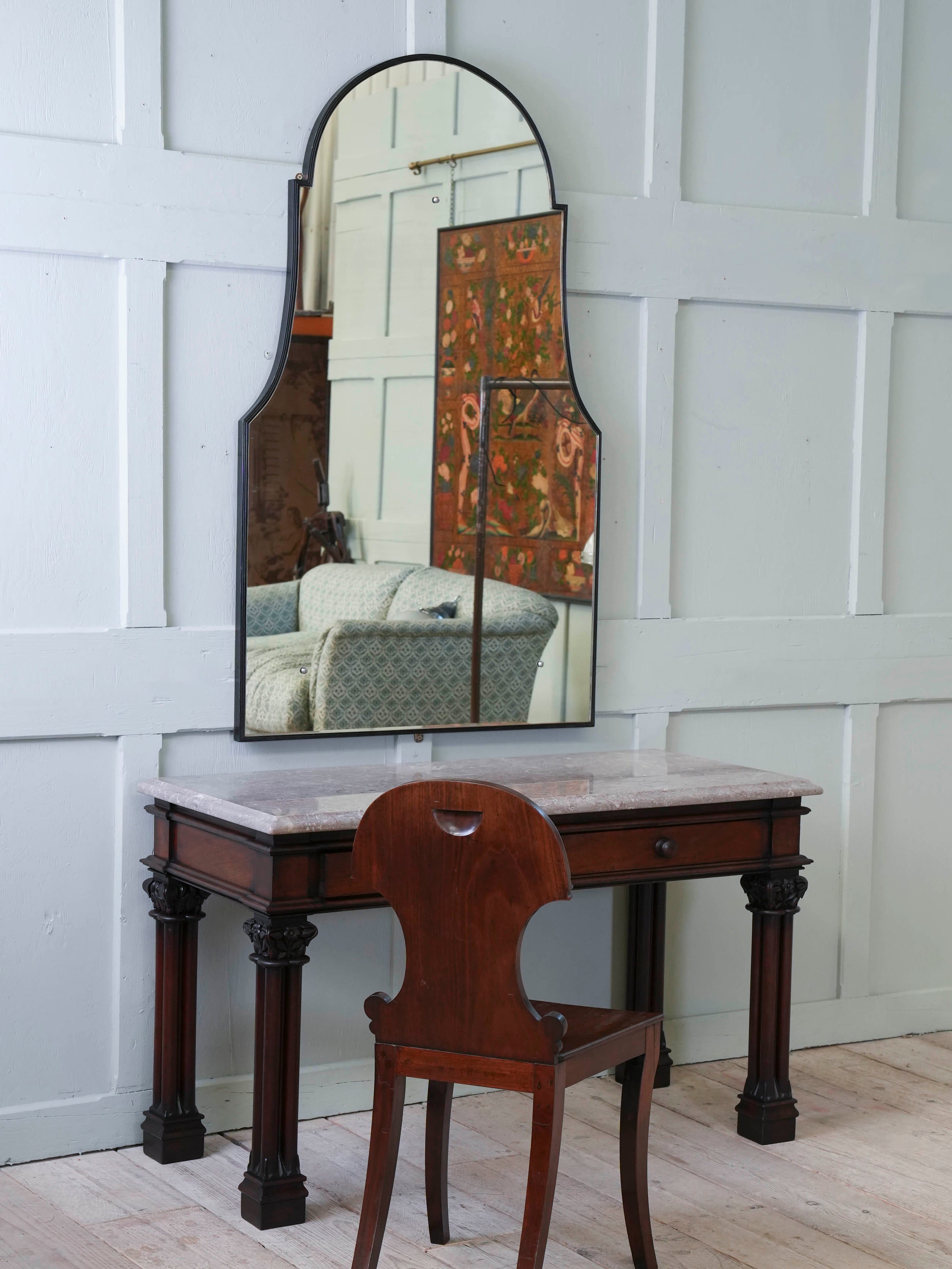 A Domed Top Mirror in a Reeded Timber frame