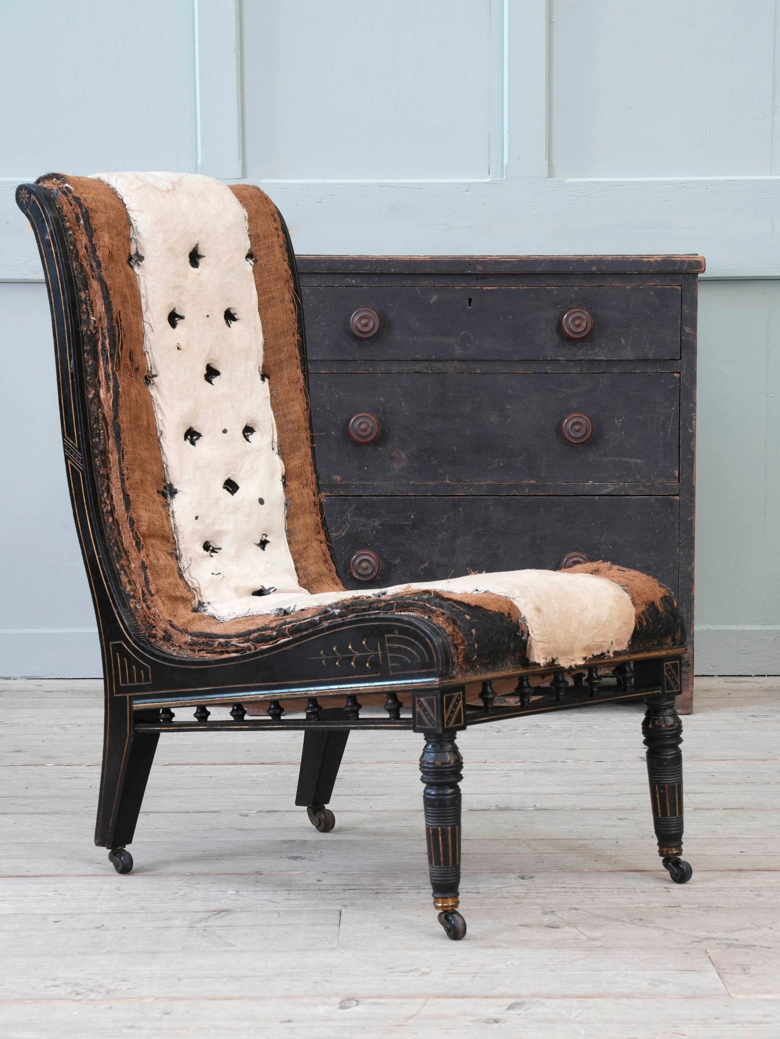 An Ebonised Aesthetic Movement Upholstered Chair