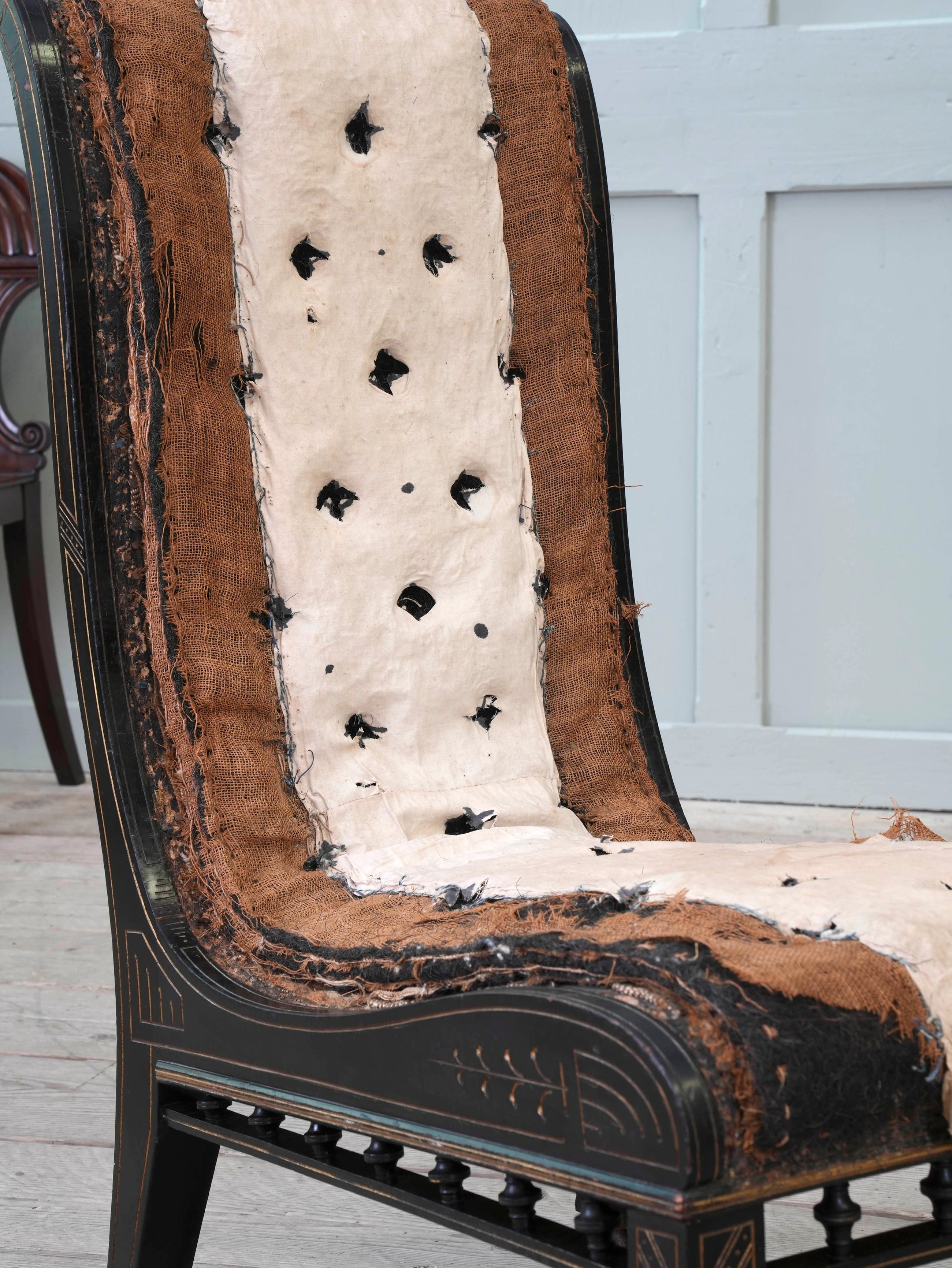 An Ebonised Aesthetic Movement Upholstered Chair