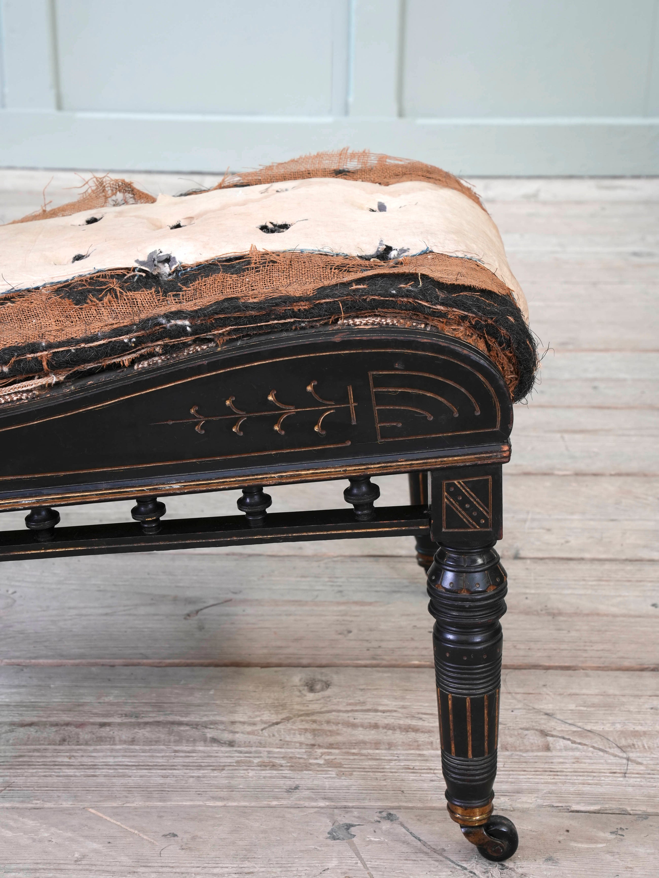 An Ebonised Aesthetic Movement Upholstered Chair