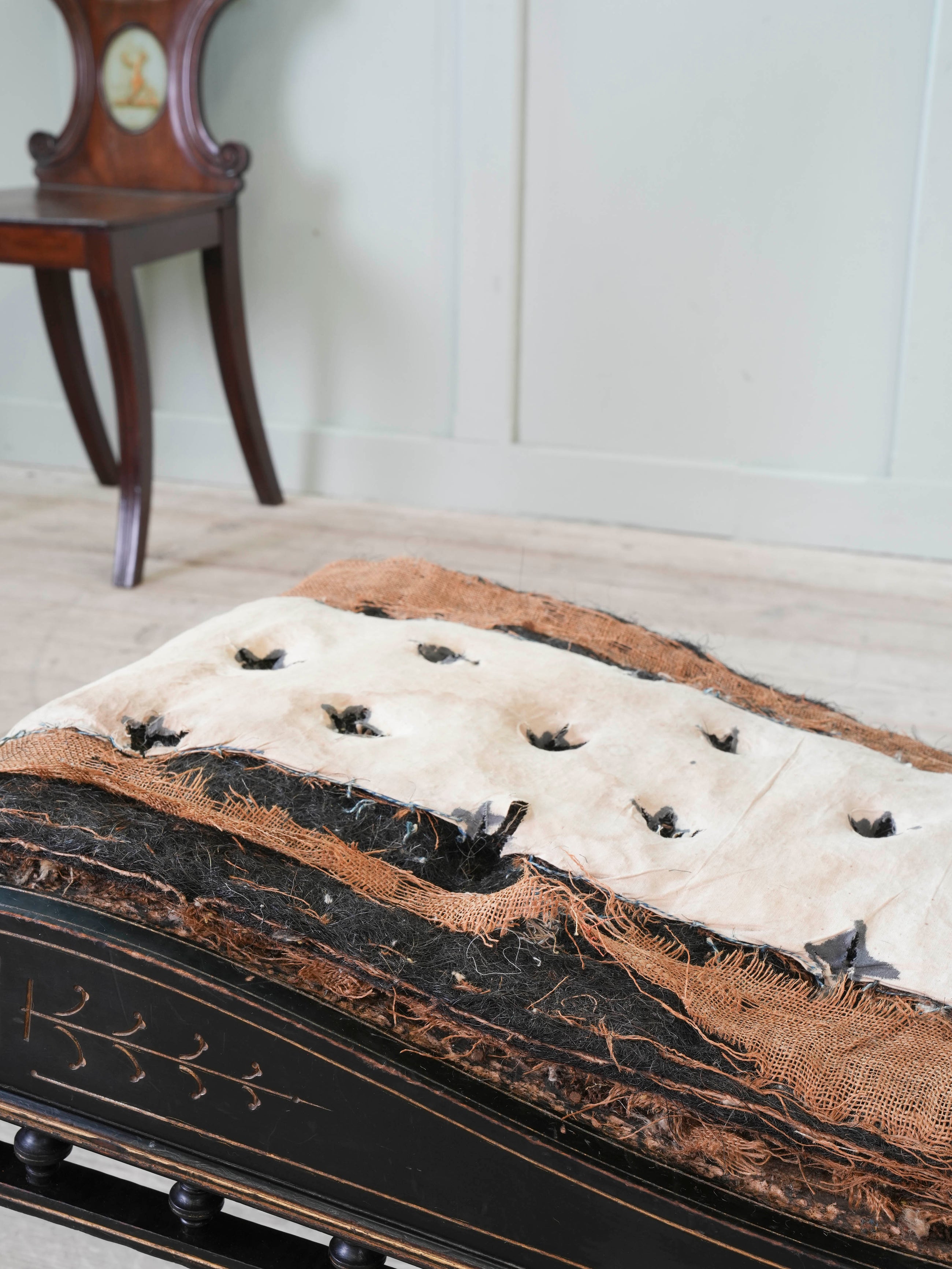 An Ebonised Aesthetic Movement Upholstered Chair
