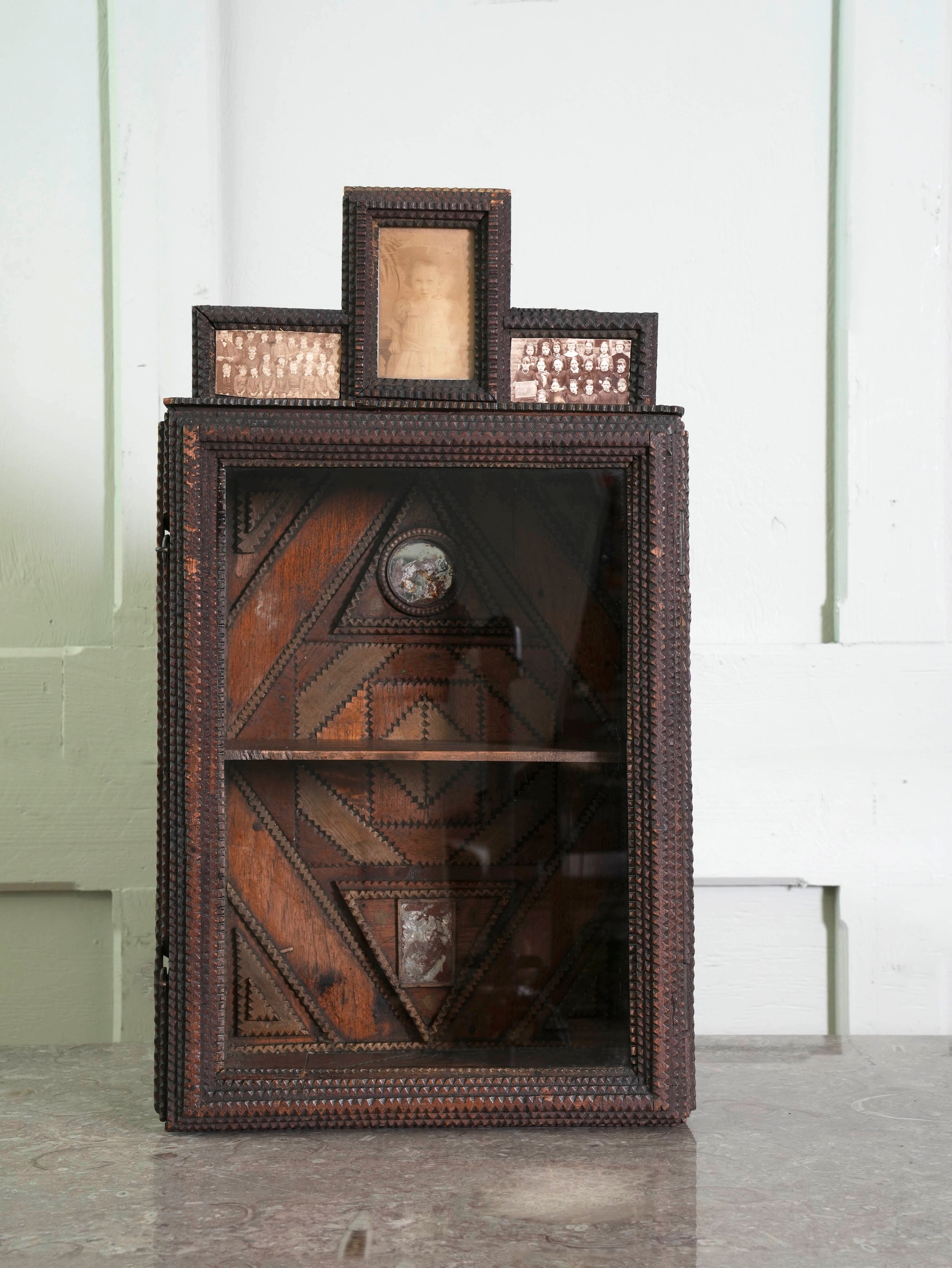 A Glazed Tramp Art Cabinet