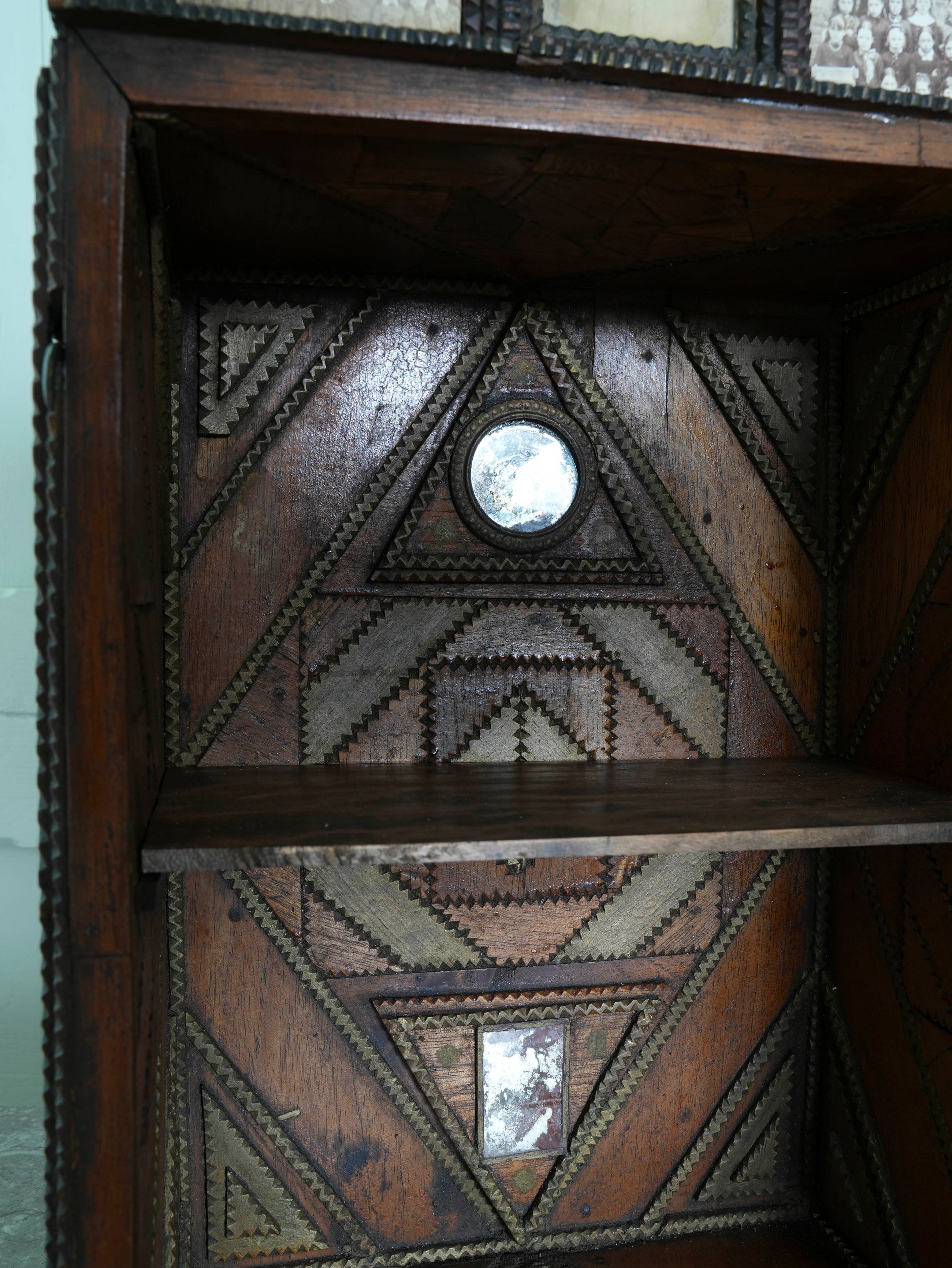 A Glazed Tramp Art Cabinet