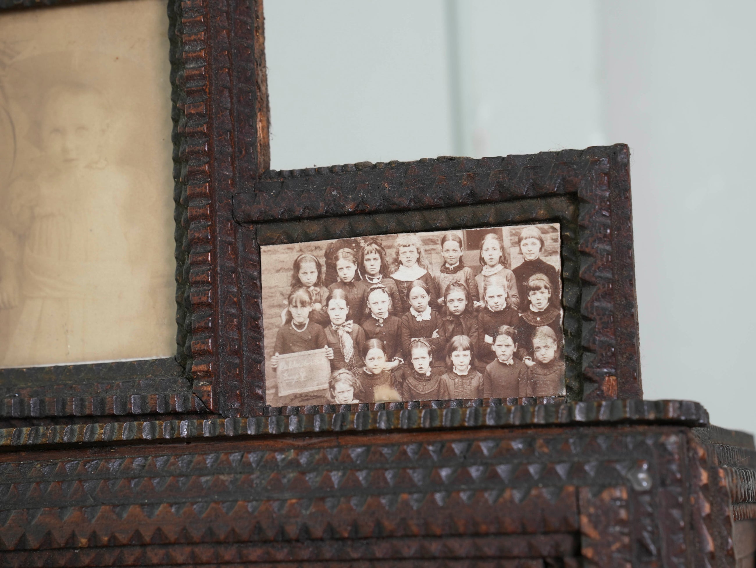 A Glazed Tramp Art Cabinet