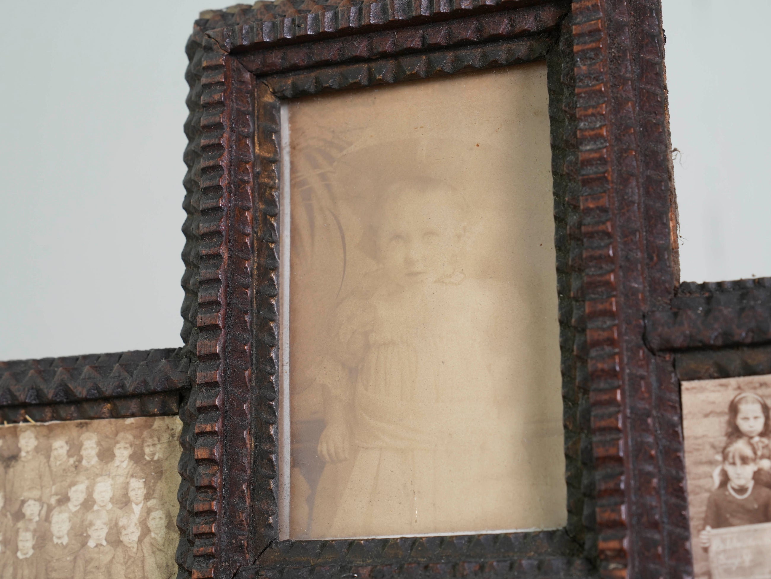 A Glazed Tramp Art Cabinet