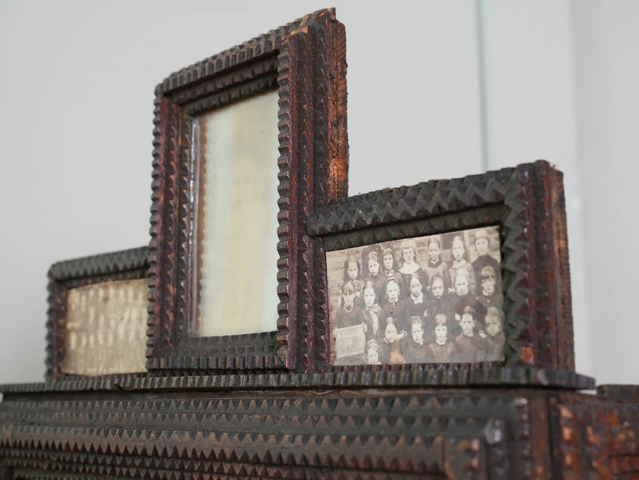 A Glazed Tramp Art Cabinet