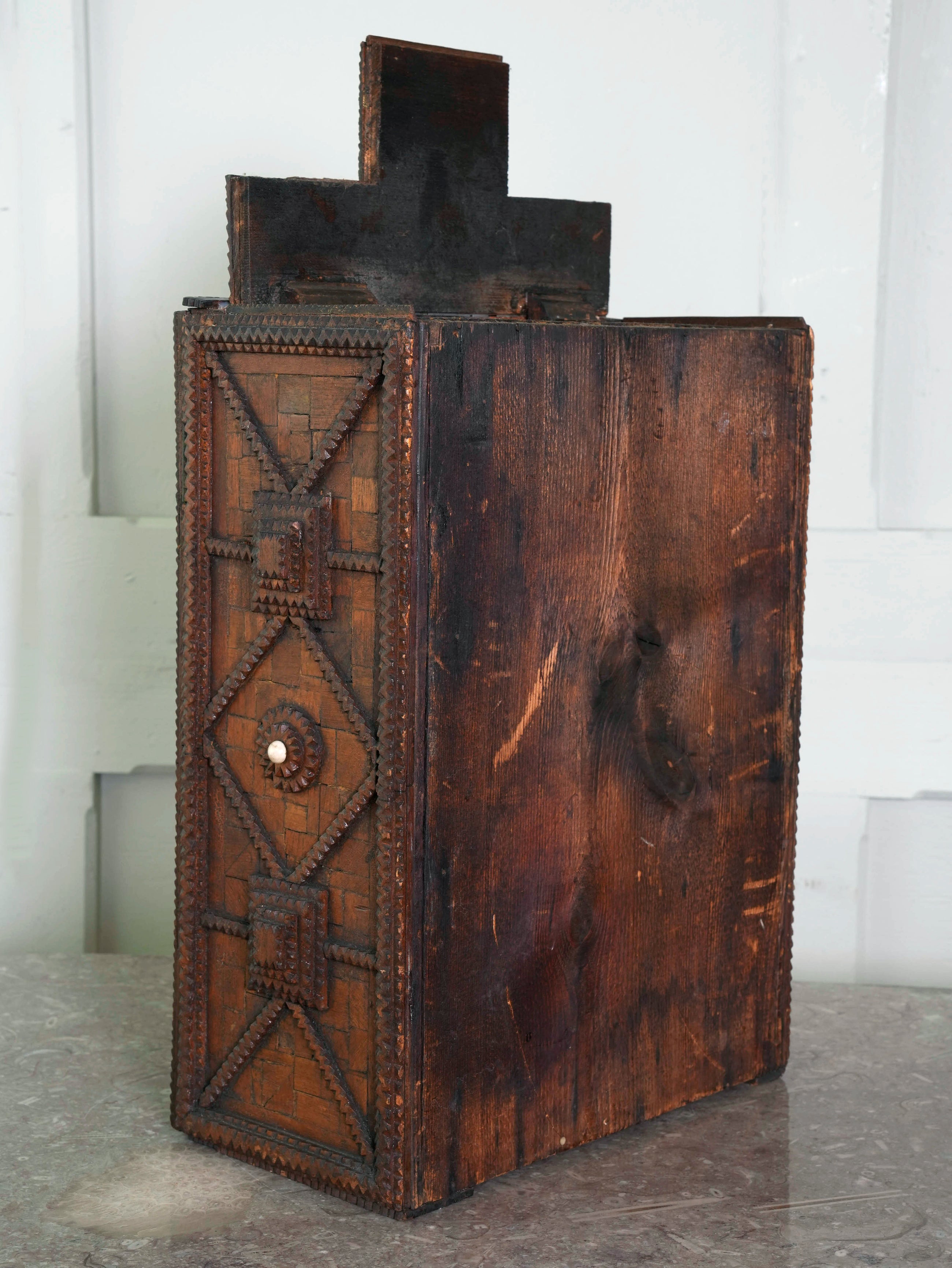 A Glazed Tramp Art Cabinet