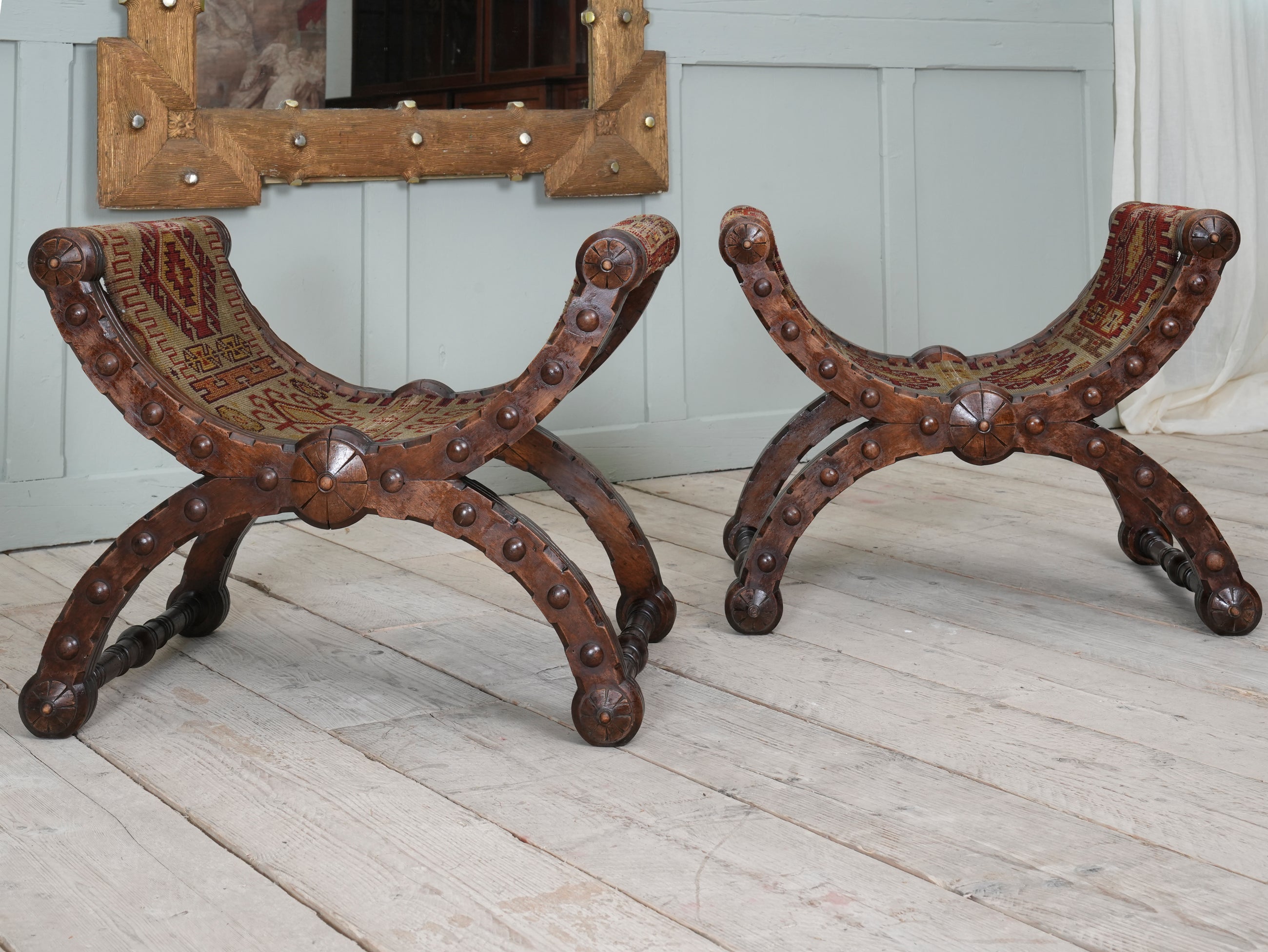 A Pair of Reformed Gothic X Frame Mahogany Stools